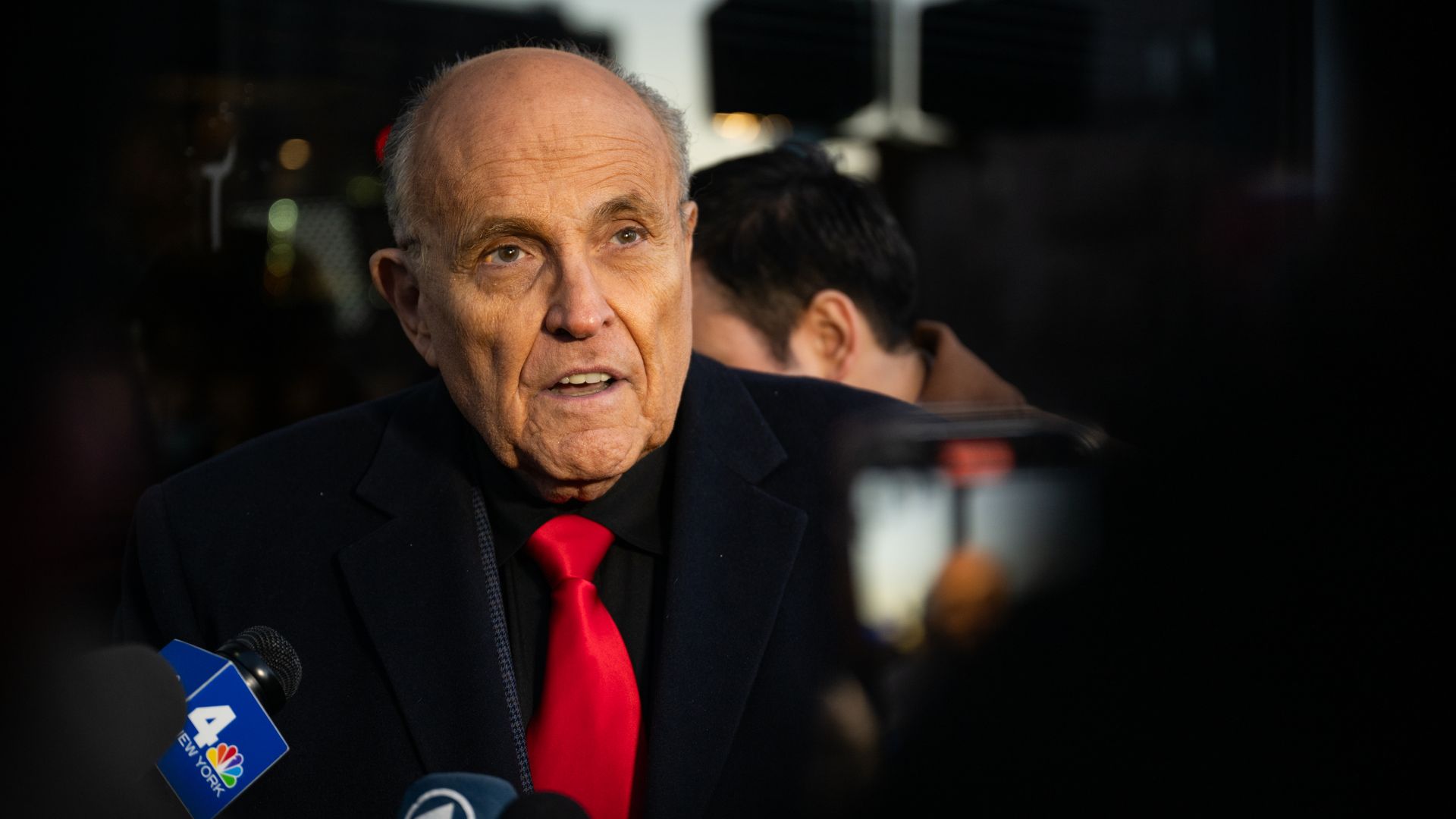 Rudy Giuliani speaks to members of the media where Republican candidate Florida Gov. Ron DeSantis was scheduled to host a campaign event on January 21, 2024 in Manchester, New Hampshire.