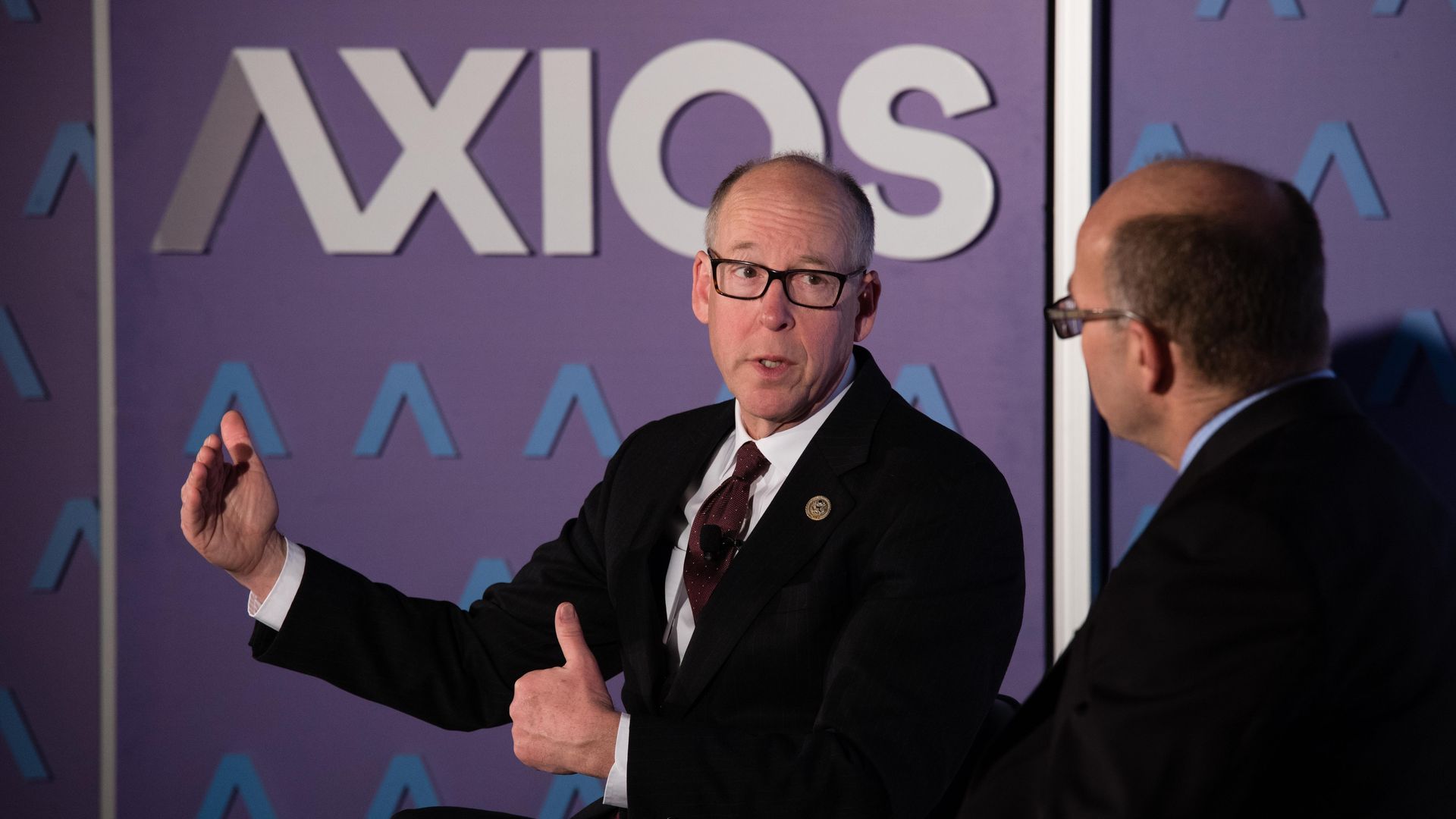 Rep. Greg Walden in front of an Axios logo