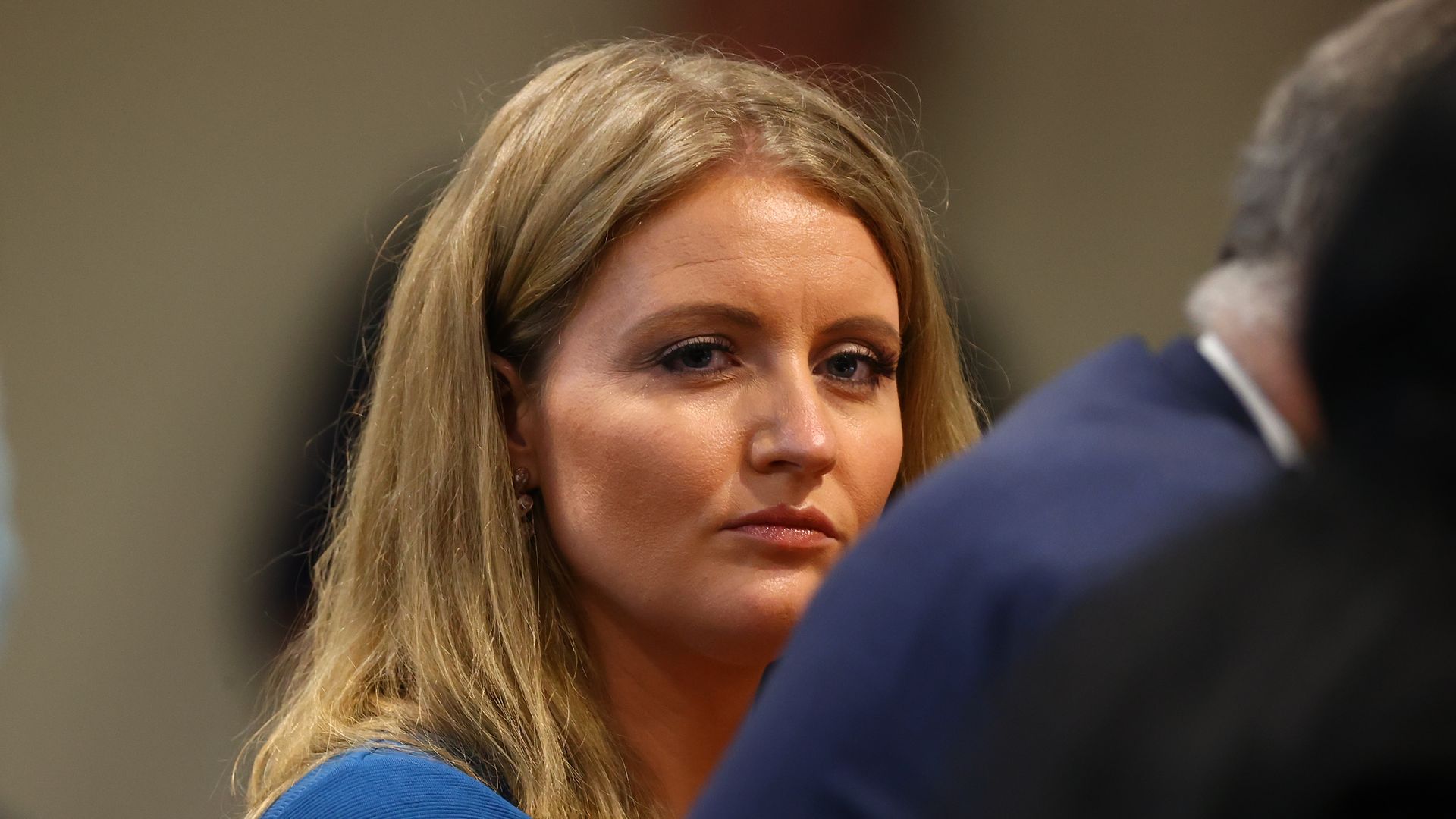 : Jenna Ellis, a member of U.S. President Donald Trump's legal team, listens to Detroit poll worker Jessi Jacobs during an appearance before the Michigan House Oversight Committee on December 2, 2020 in Lansing, Michigan. 
