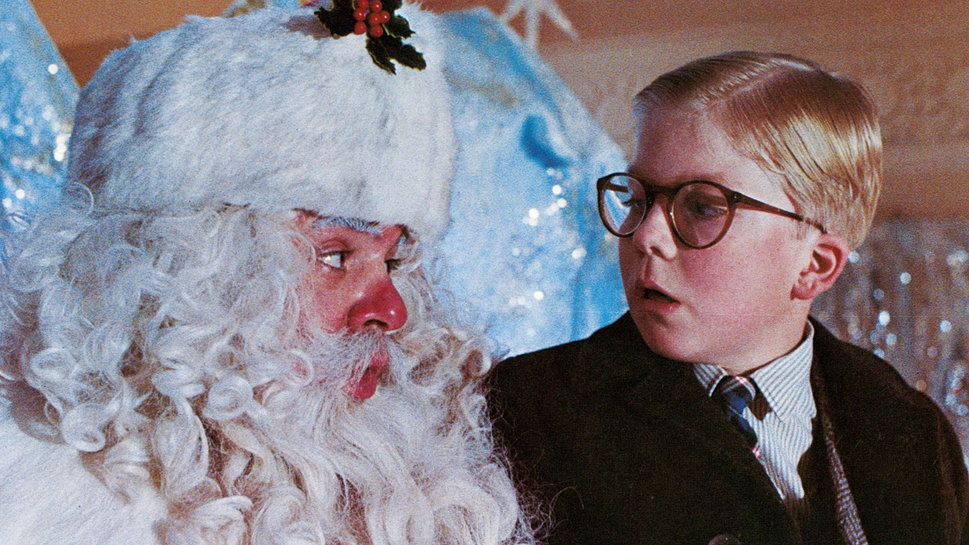 The scene from "A Christmas Story" with Ralphie sitting on Santa's lap. 