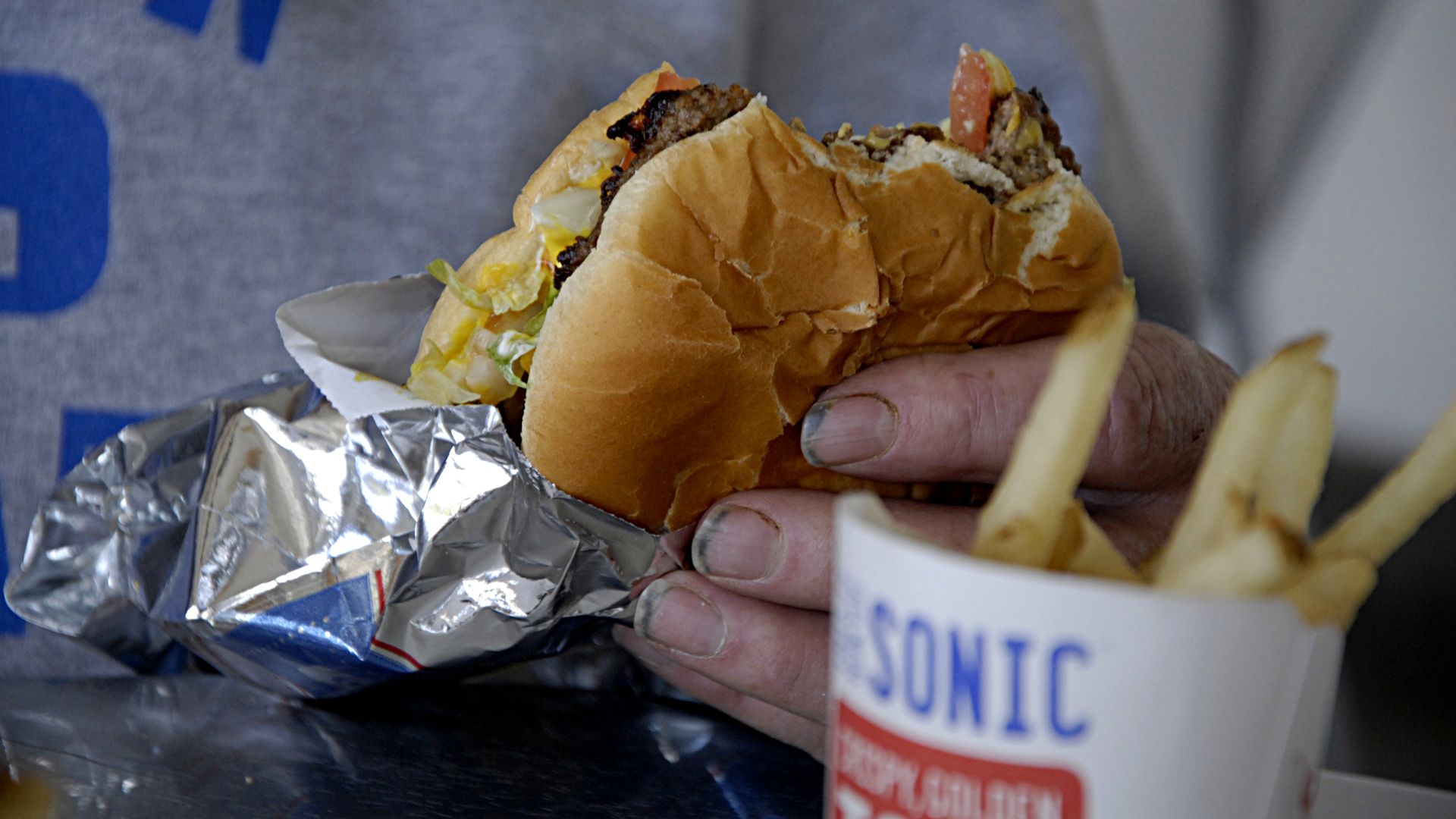 A burger and french fries from a Sonic restaurant.