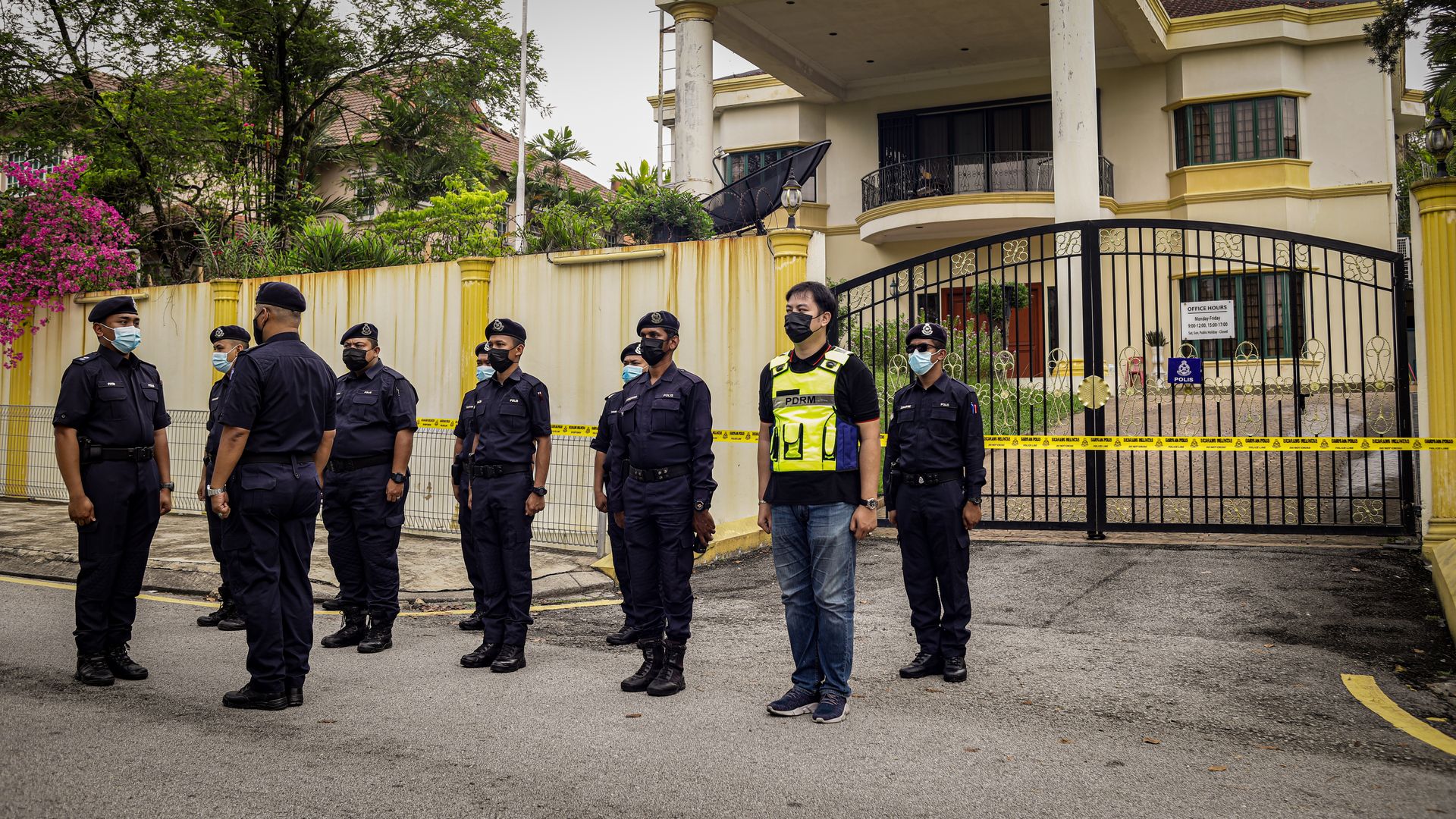Police officers outside North Korea embassy in Malaysia