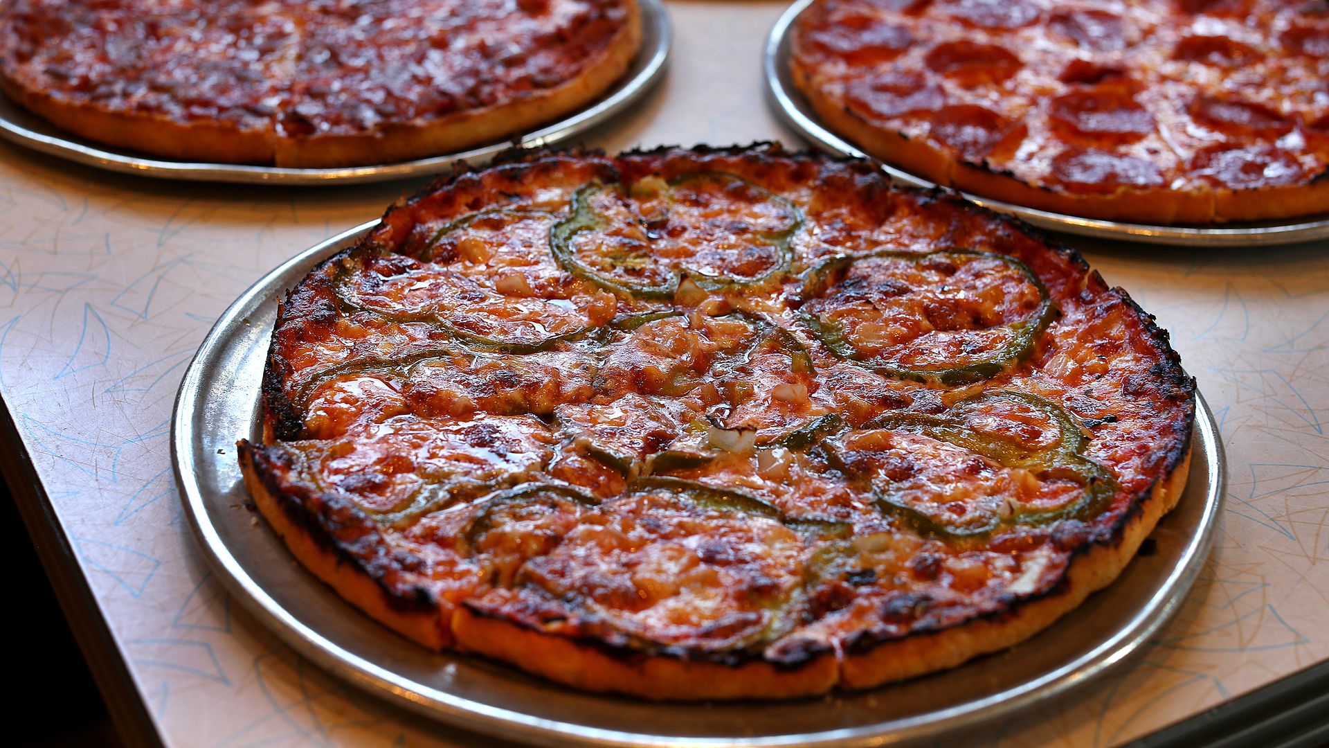 Putting South Shore bar pizza on - 1753288799301