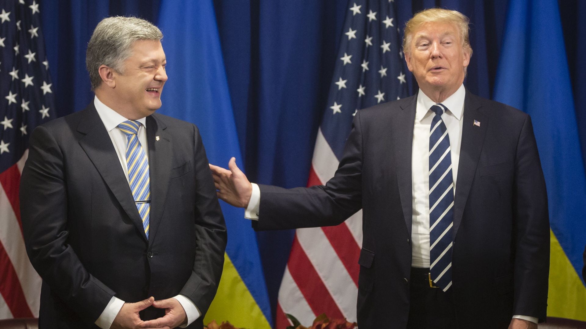 Ukraine's president and President Trump smile at an event in 2017.