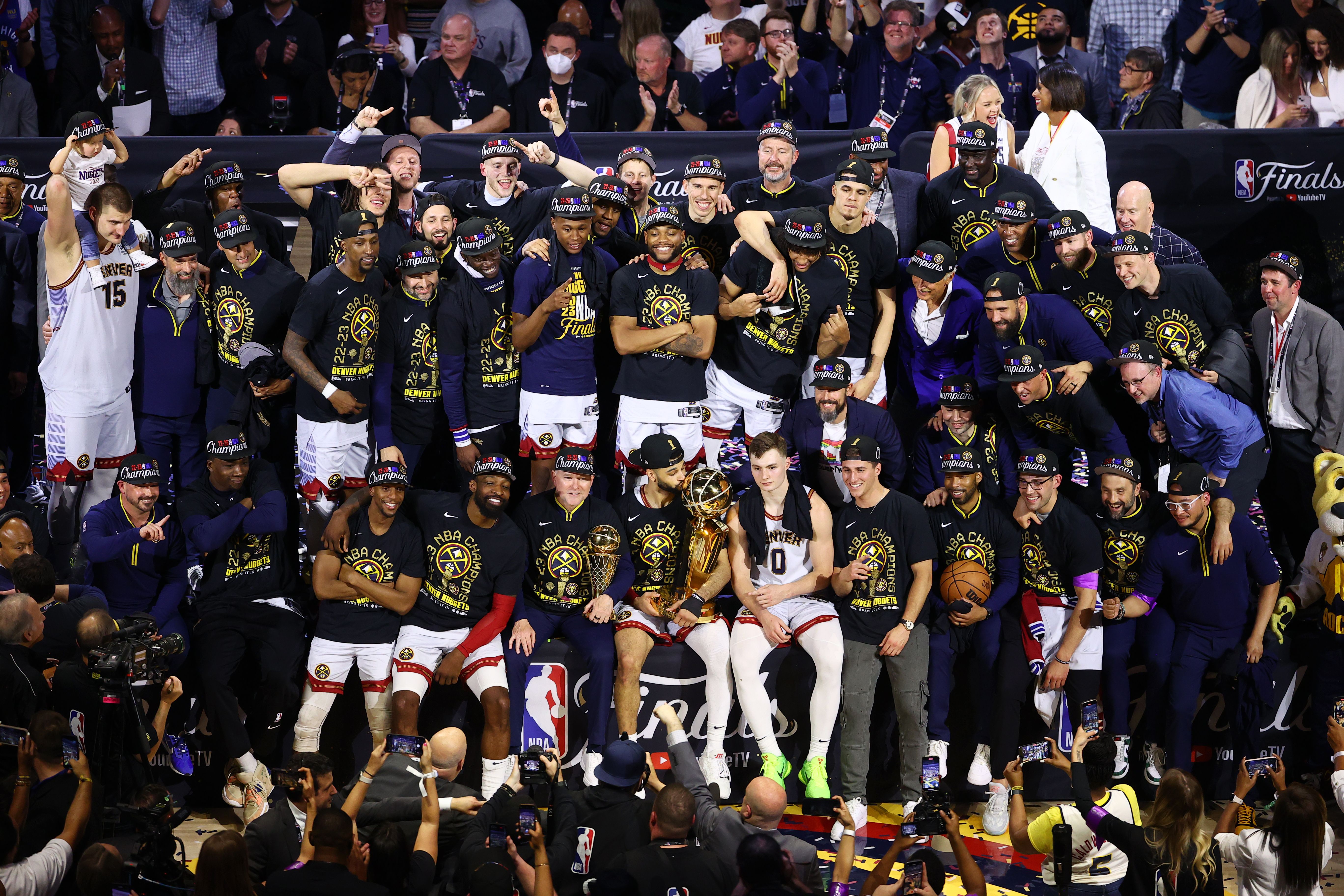 A basketball team celebrating