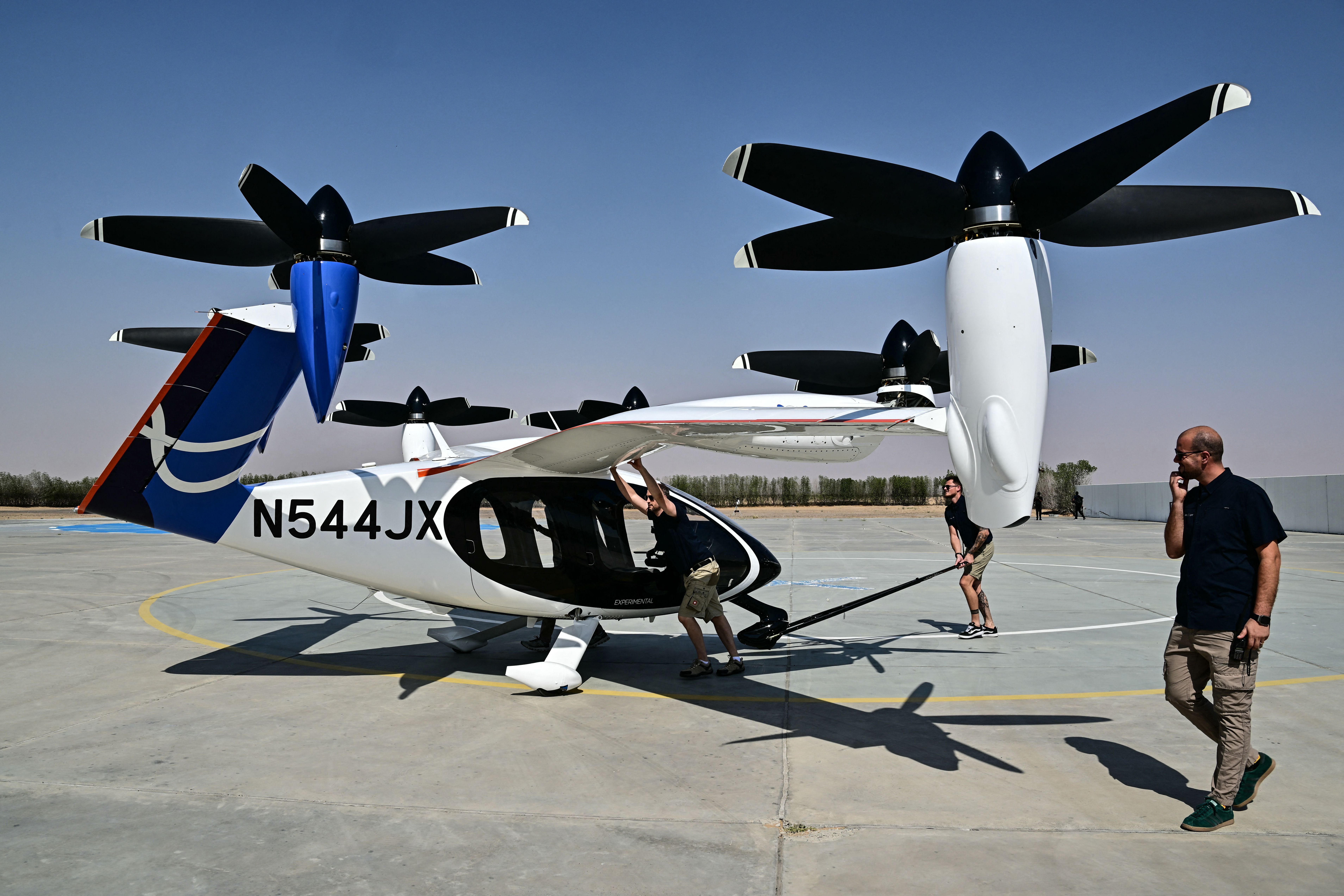 A Joby Aviation's all-electric air taxi sits on the tarmac after performing a flight demonstration during a media presentation in Dubai on February 25, 2026. (Photo by Giuseppe CACACE / AFP via Getty Images)
