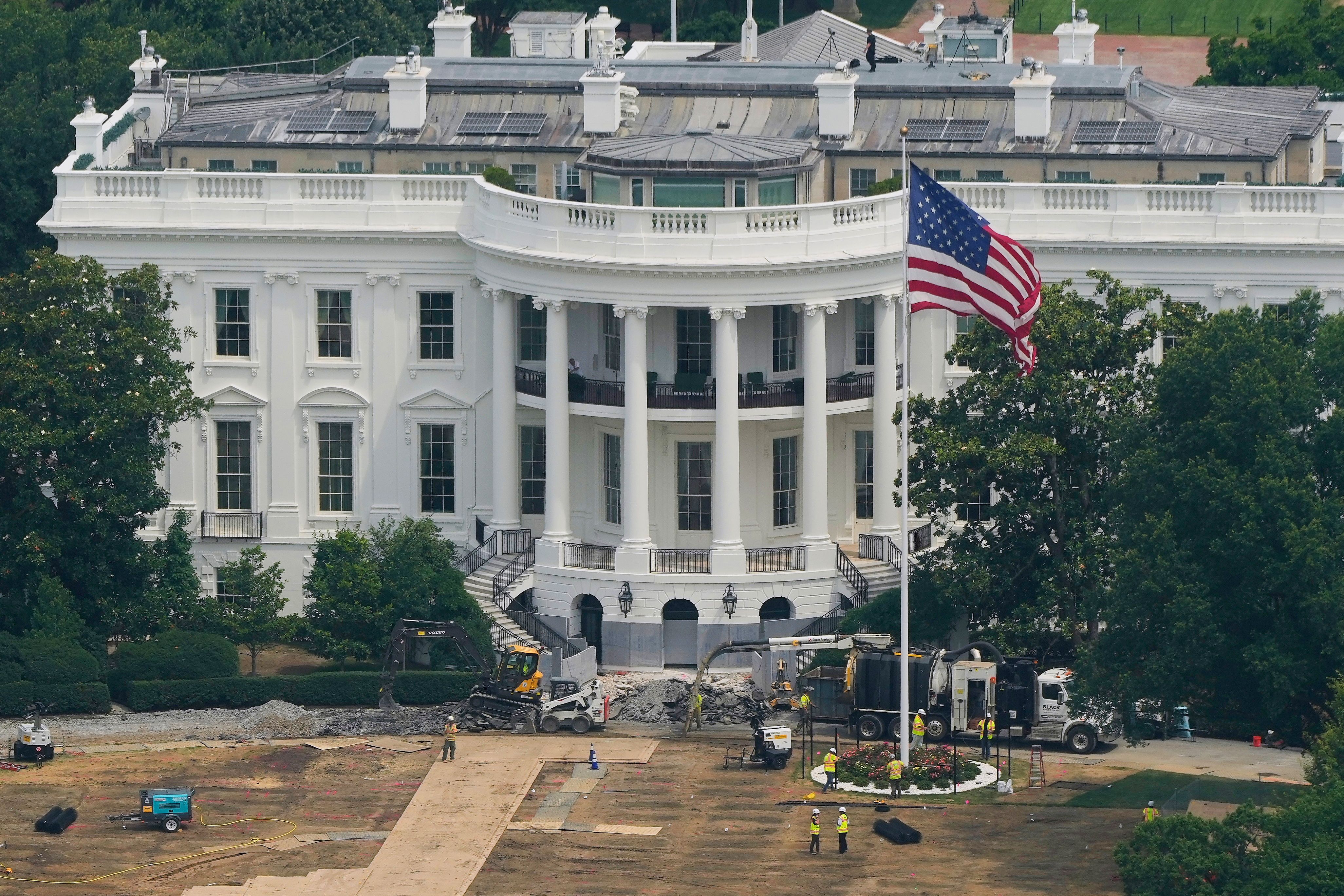 Workers are seen on the South Lawn of the White House as construction continues on the White House Ballroom, as seen from the Washington Monument, Friday, June 26, 2026, in Washington. (AP Photo/Carolyn Kaster)