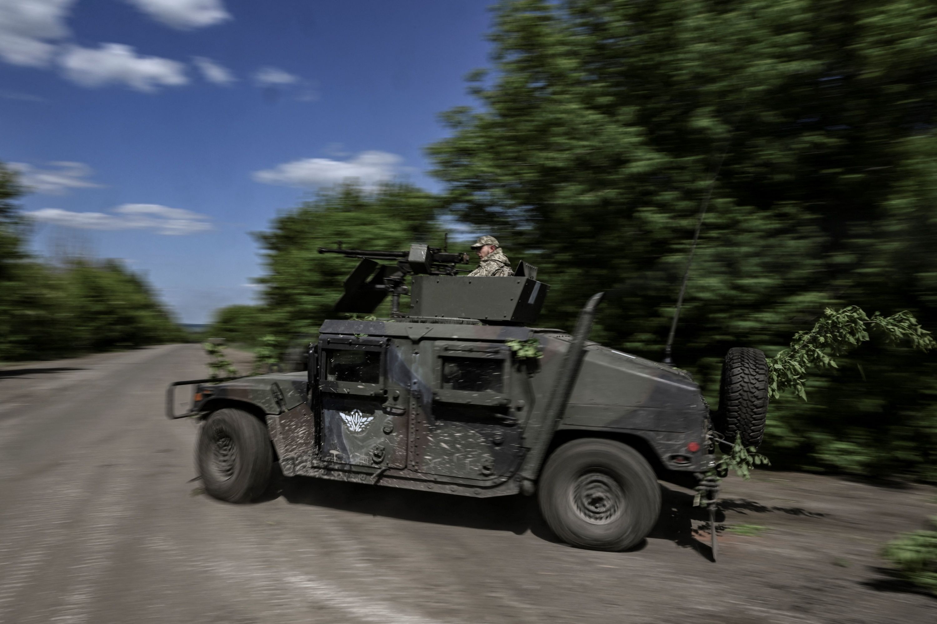 Ukrainian servicemen move toward the frontline at a checkpoint near the city of Lysychansk in the eastern Ukranian region of Donbas, on May 23.
