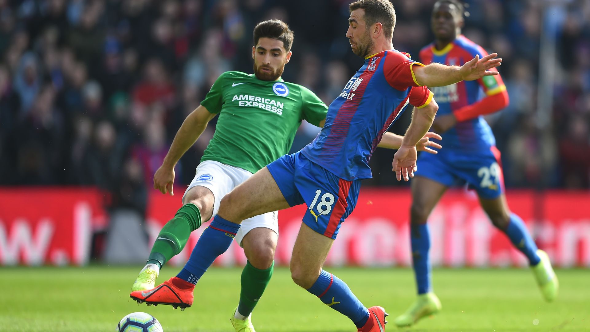 James McArthur of Crystal Palace is challenged by Alireza Jahanbakhsh of Brighton & Hove Albion during the Premier League match between Crystal Palace and Brighton & Hove Albion 