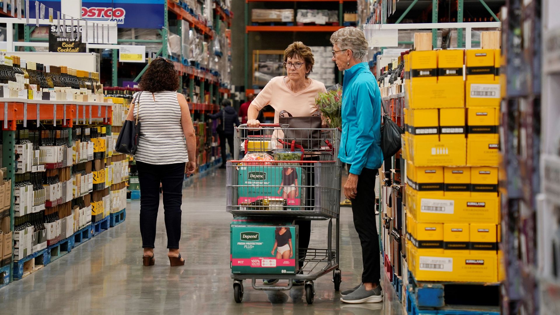 Shoppers in the aisle of a Costco