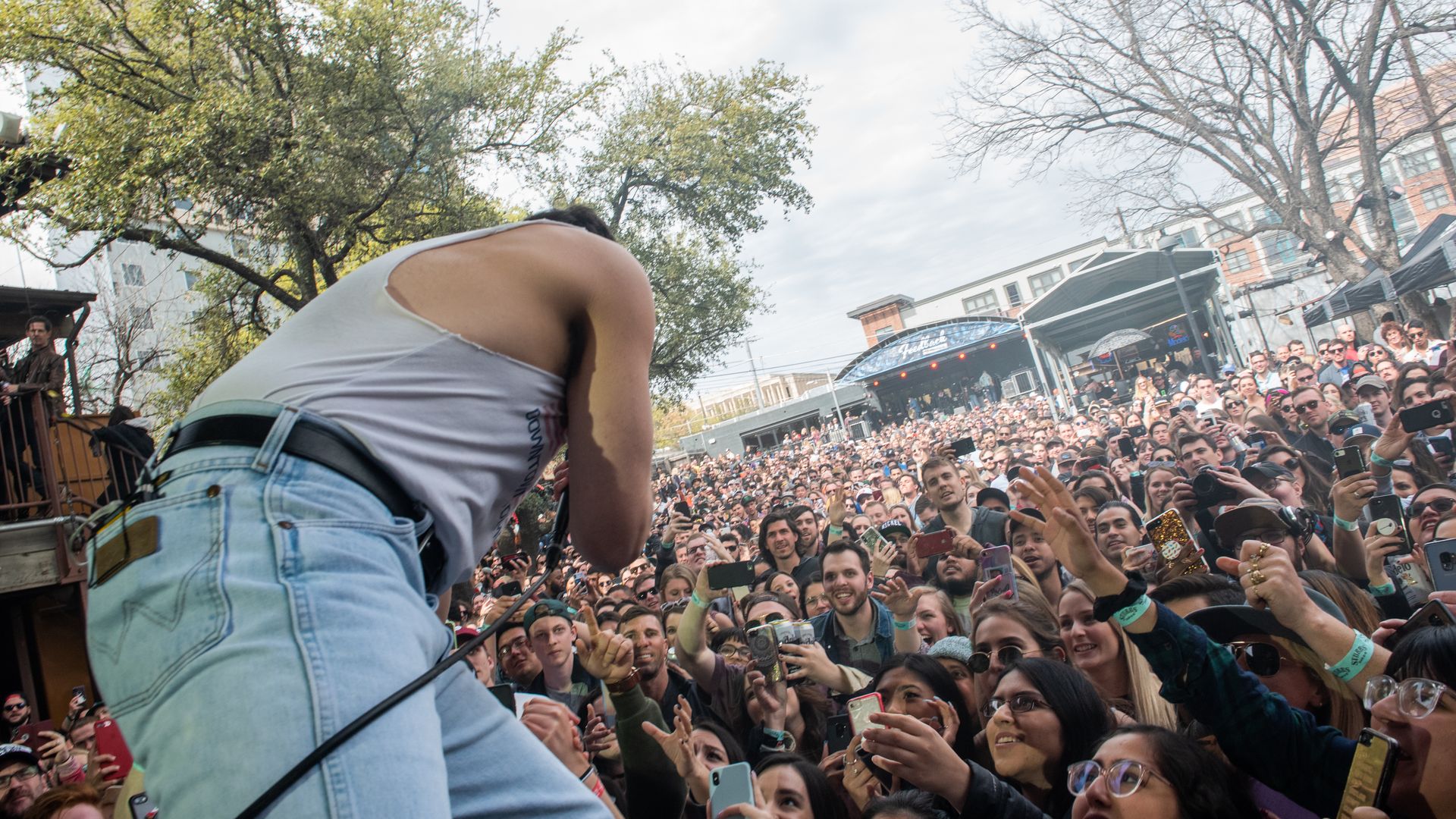 A crowd cheers Jack Antonoff as he performs at SXSW.
