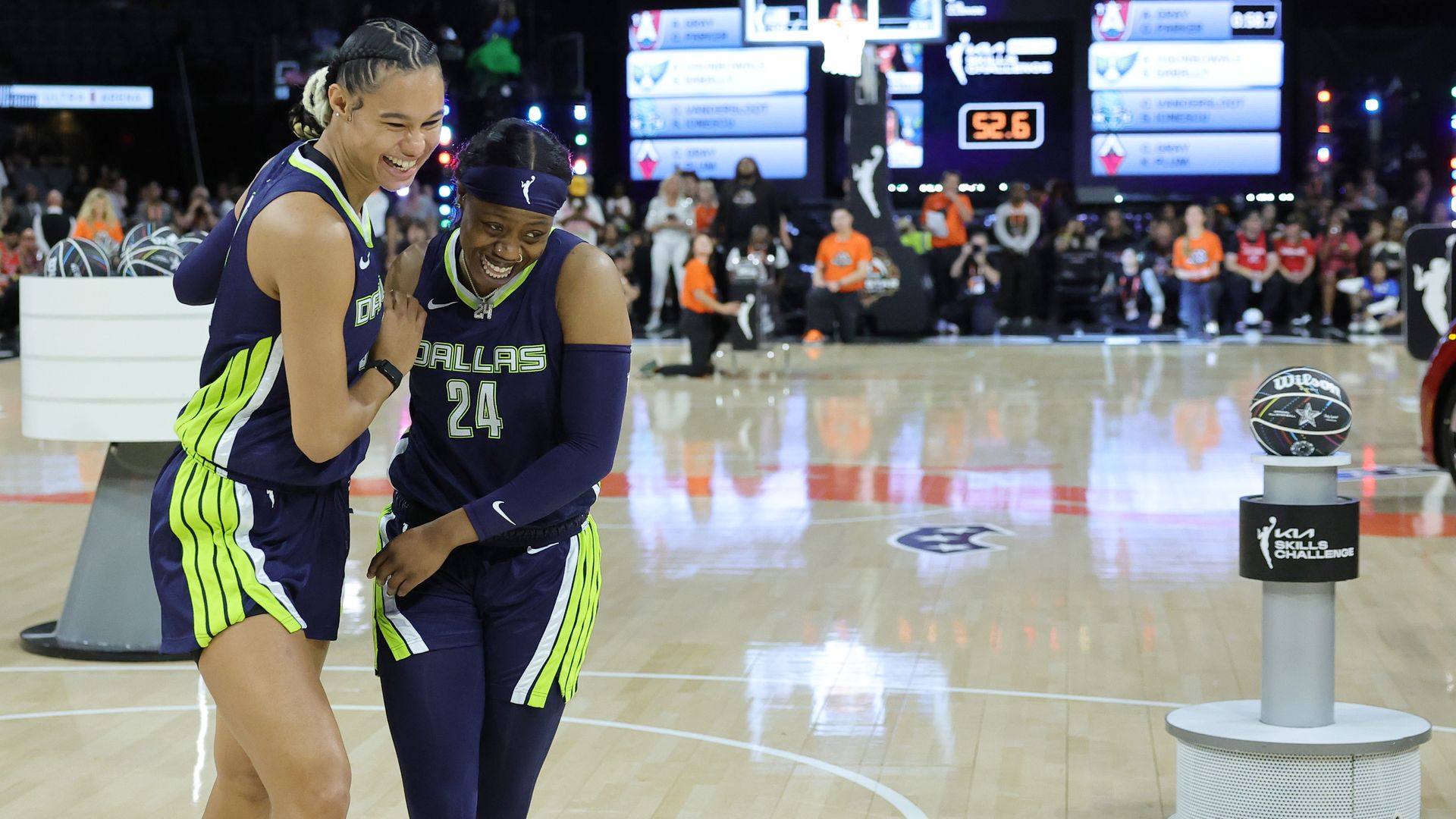 Two basketball players embrace