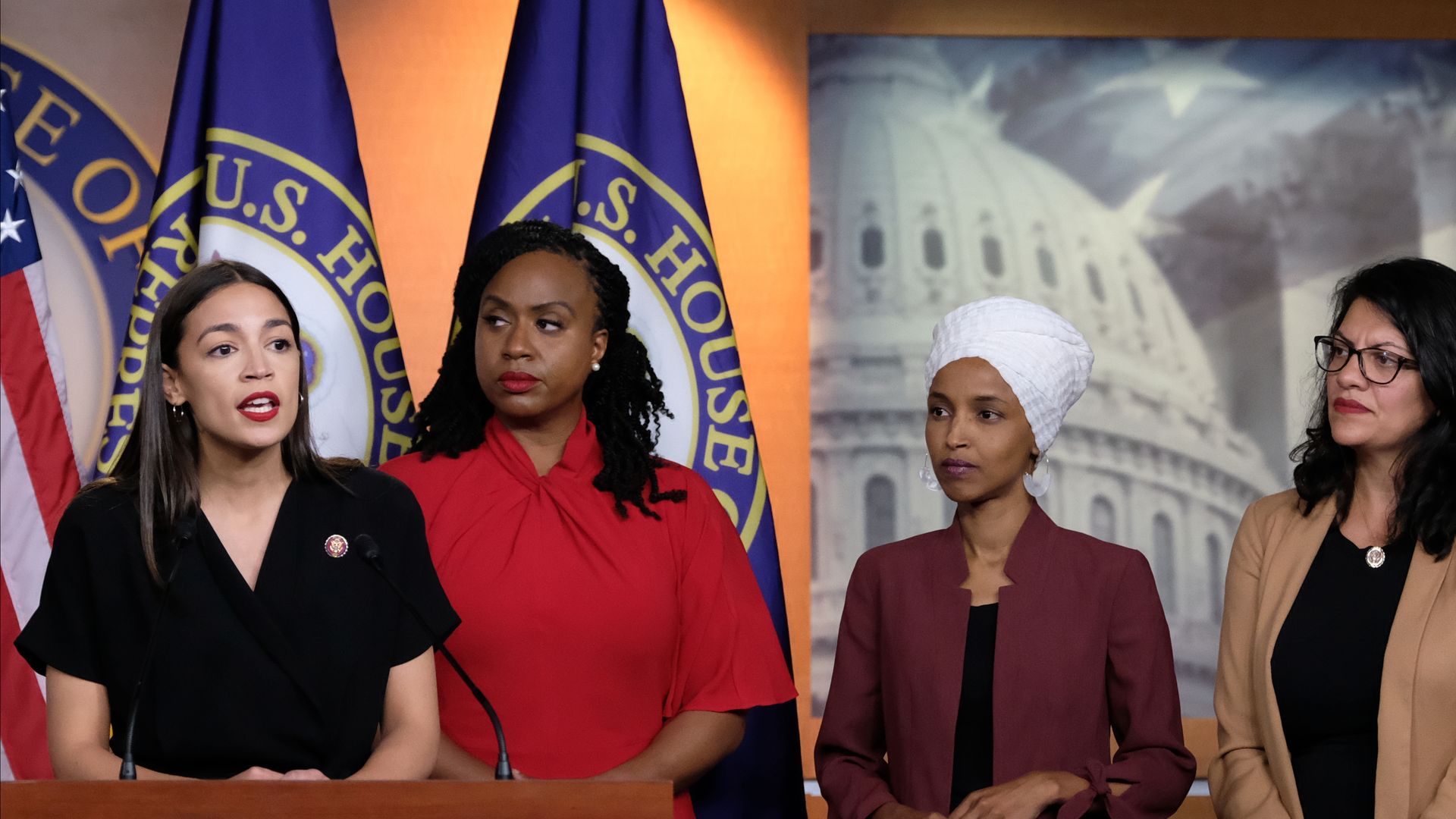 Rep. Alexandria Ocasio-Cortez (D-NY) speaks as Reps. Ayanna Pressley (D-MA), Ilhan Omar (D-MN), and Rashida Tlaib (D-MI) listen during a press conference at the US Capitol on July 15