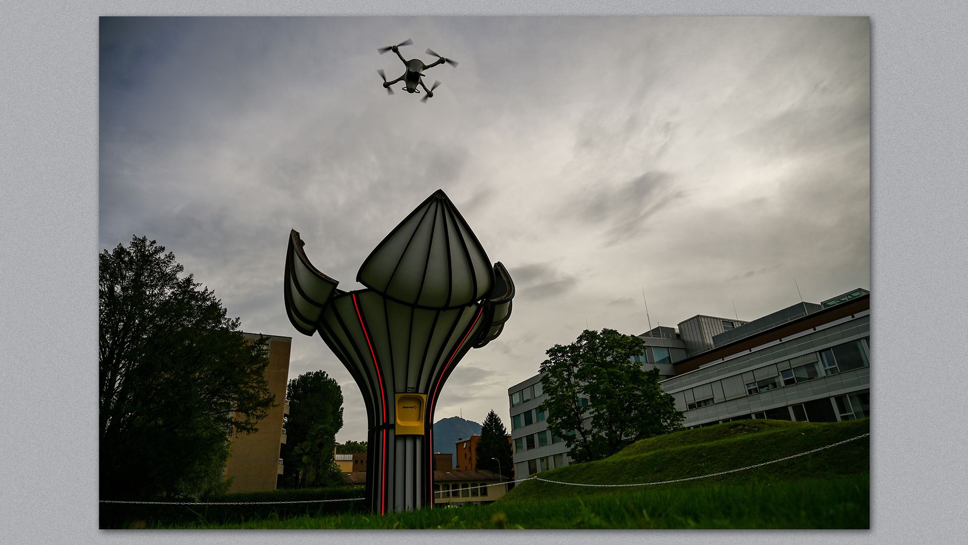 Image of Matternet's new drone station, which looks like a flower, with its petals opening, revealing a landing pad for a drone. 
