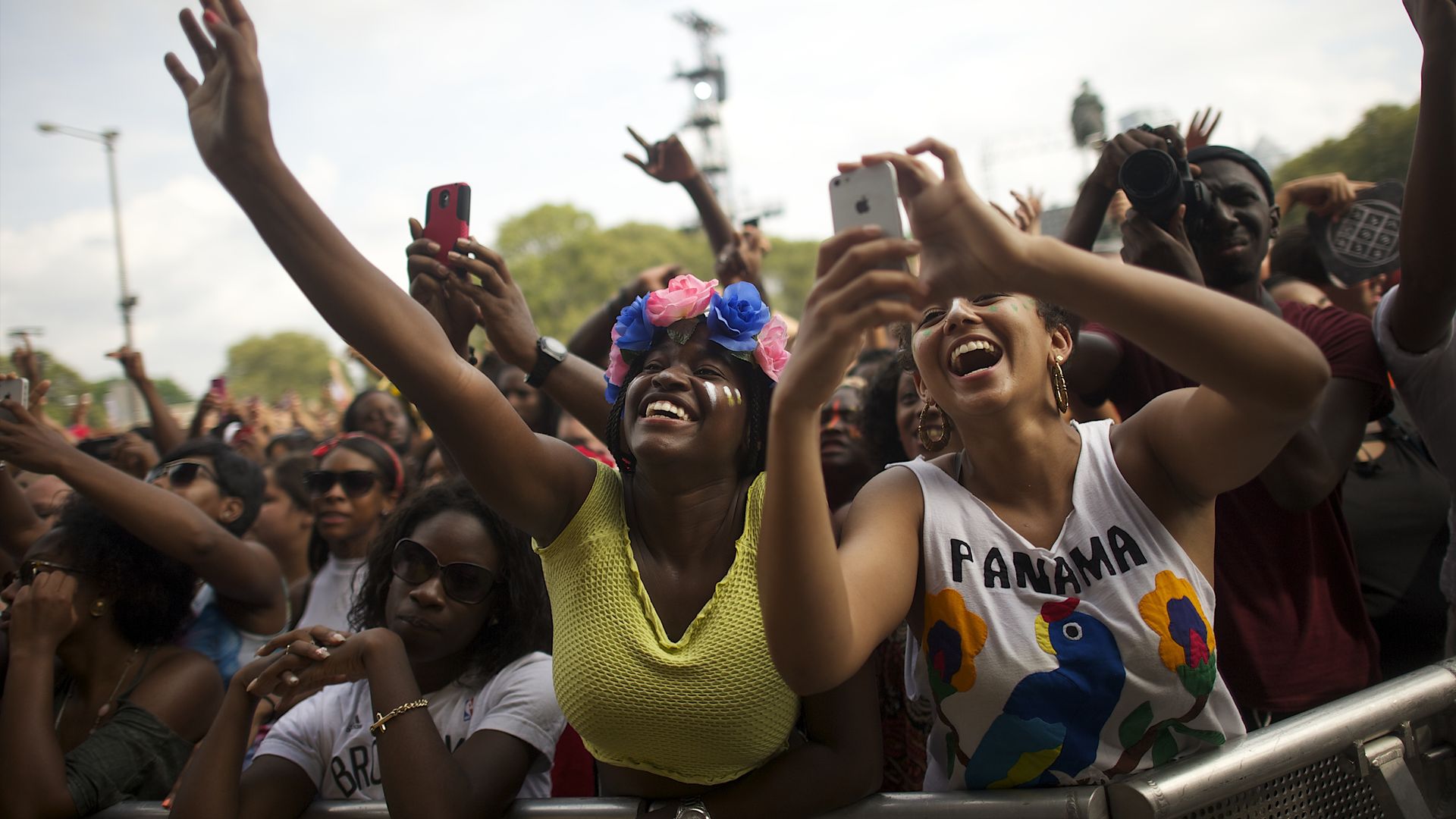 Crowds cheer at a music festival