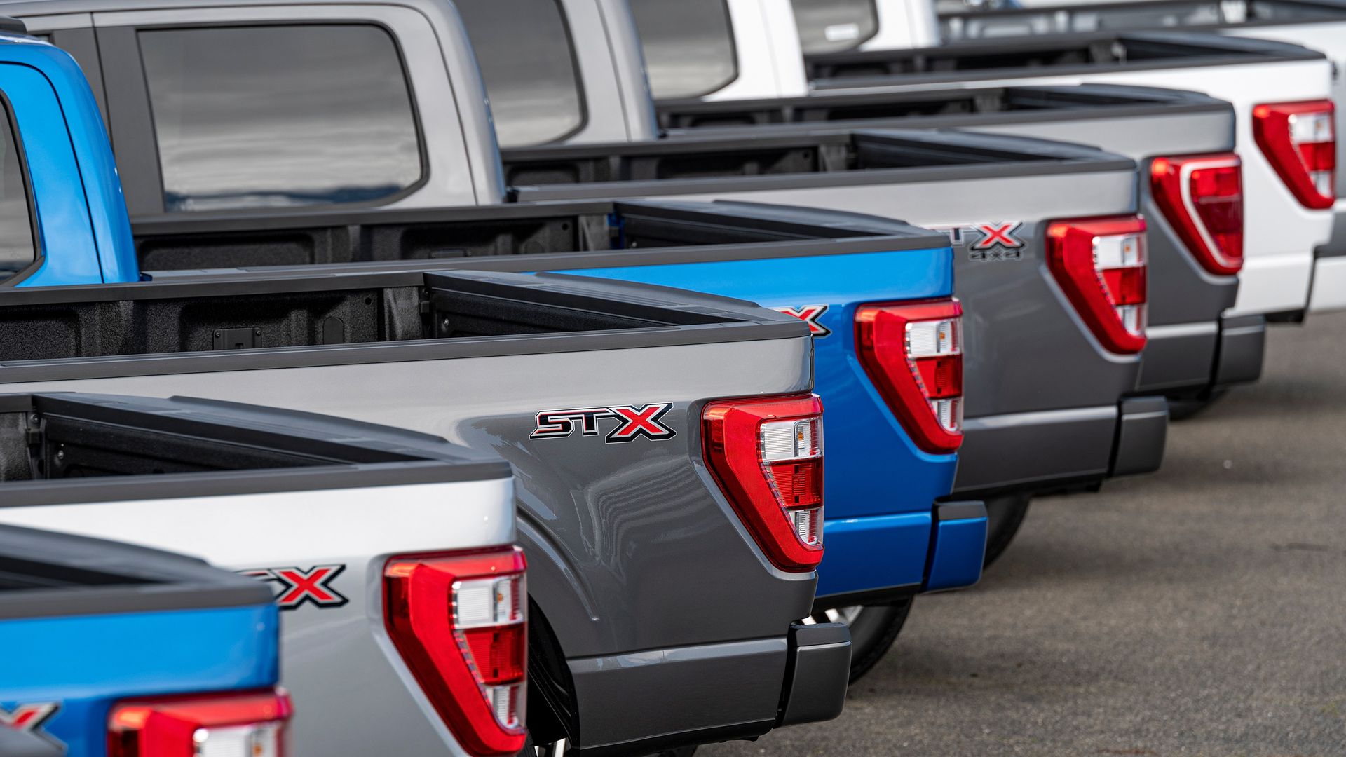 Image of a bunch of Ford F-150 pickups on a dealer lot. 