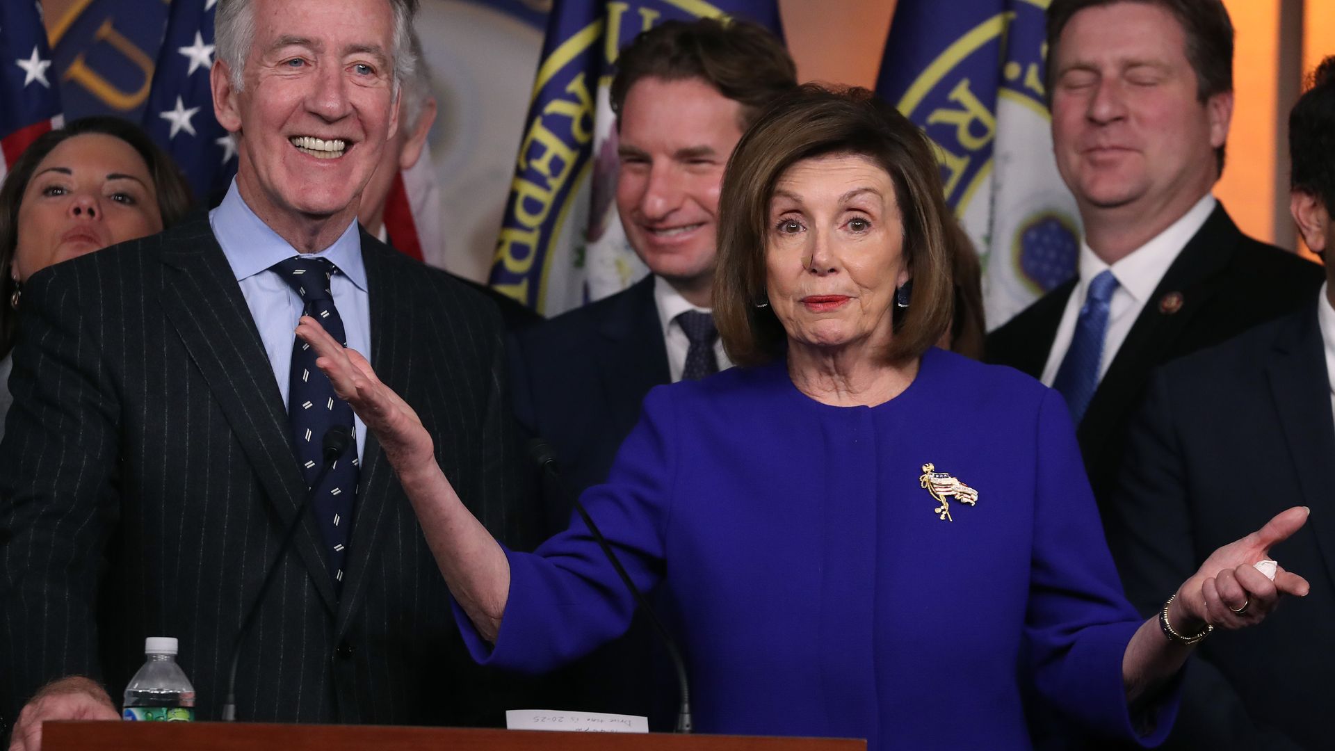 Nancy pelosi with her arms out