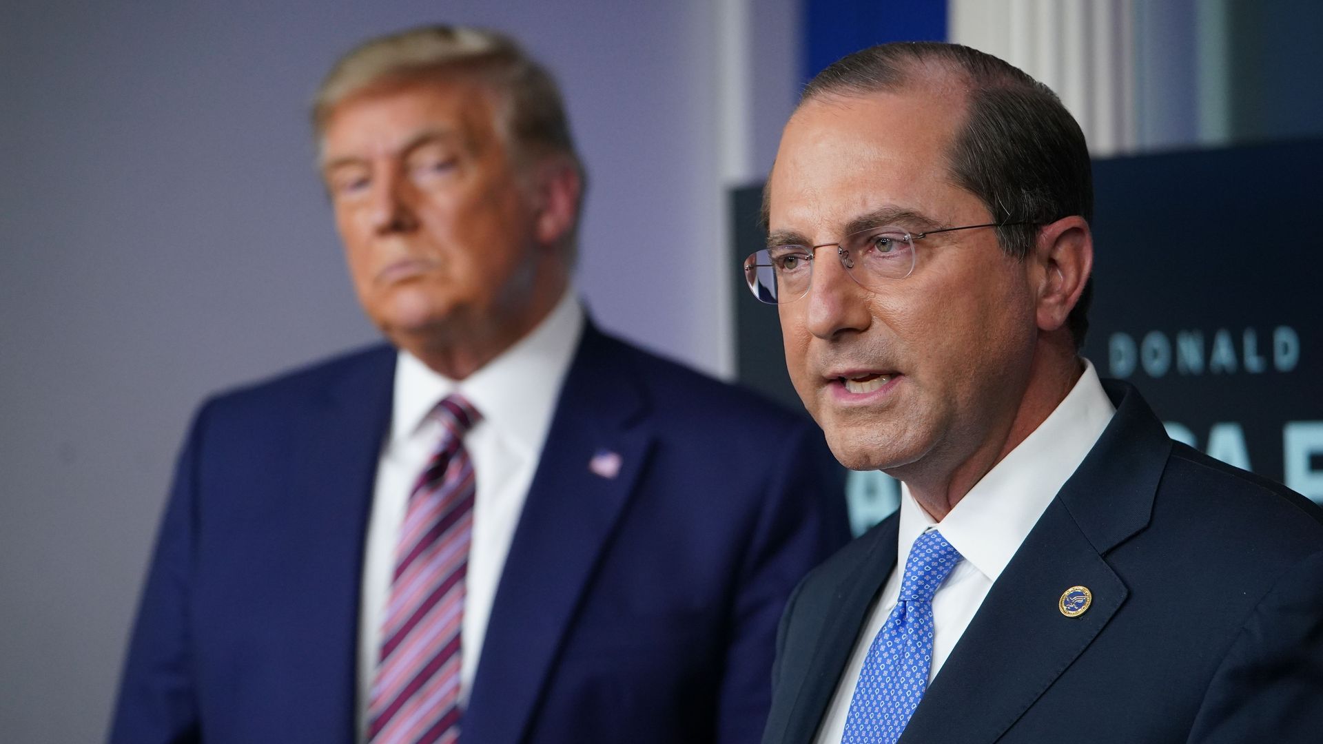 HHS secretary speaks next to Trump
