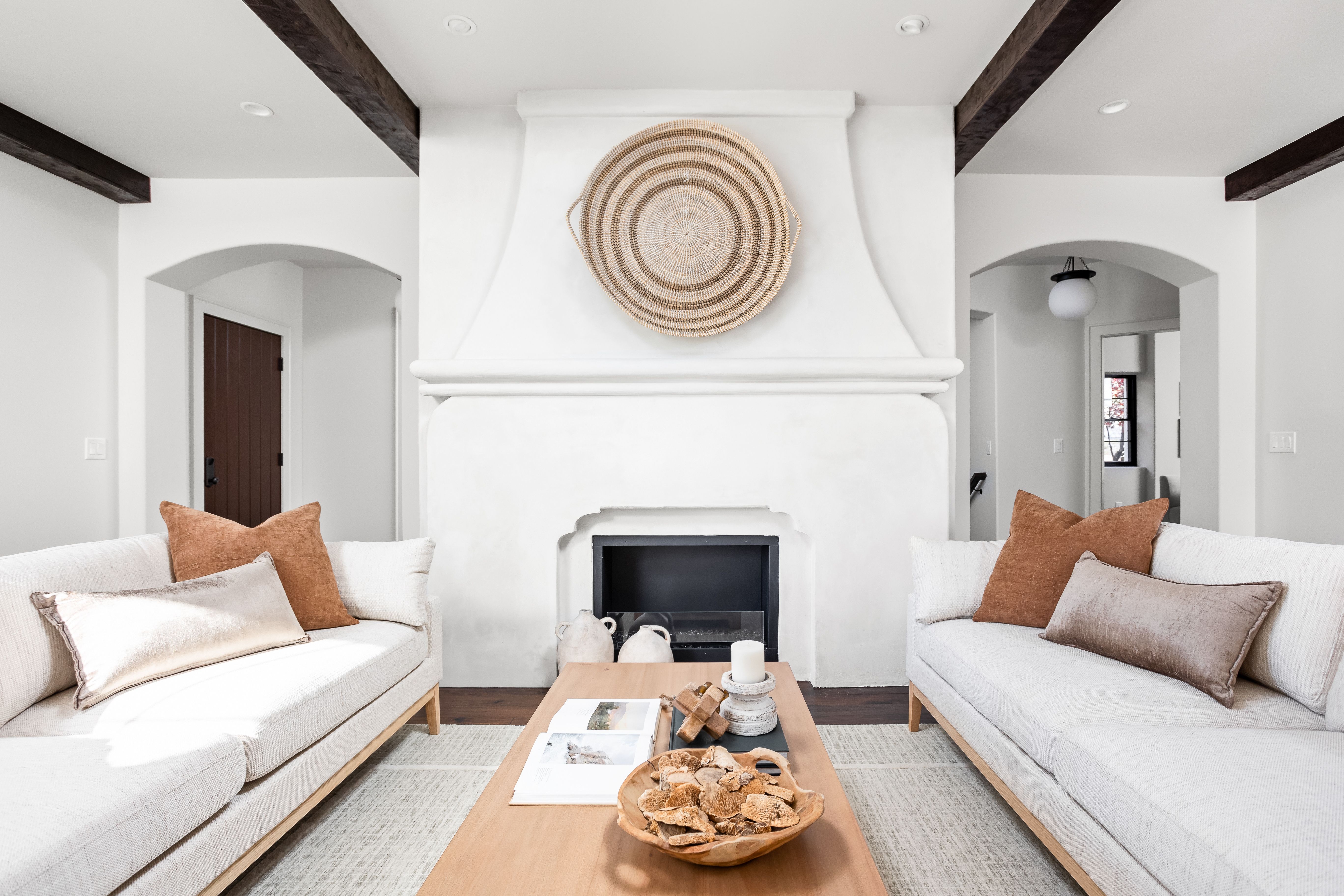 A living room with a fireplace.