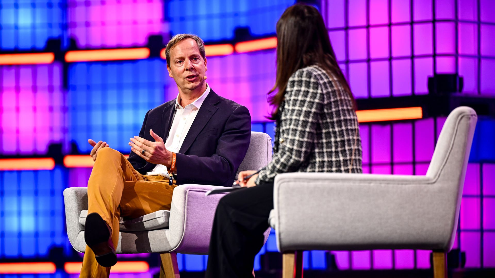 Dow Jones CEO Almar Latour and Axios' Sara Fischer speak on stage during Web Summit 2025.