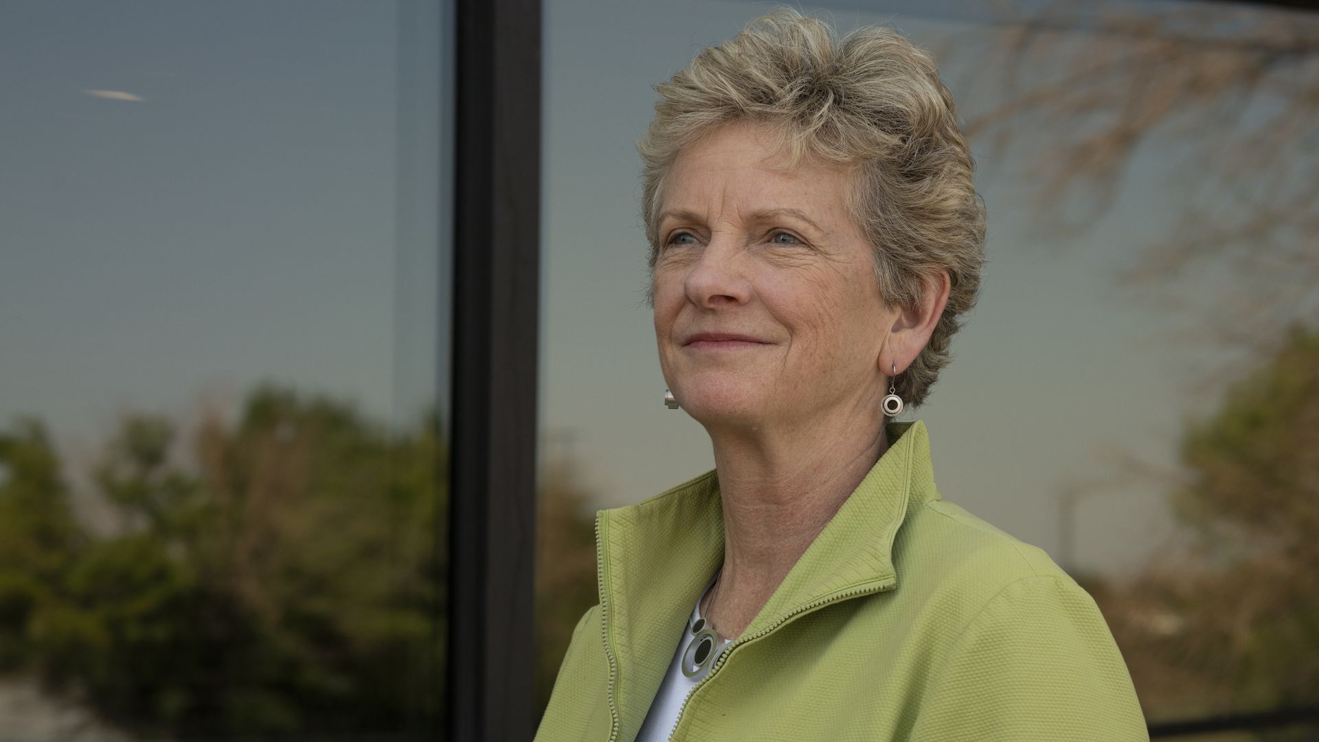 General Services Administration chief Robin Carnahan, wearing a green jacket.