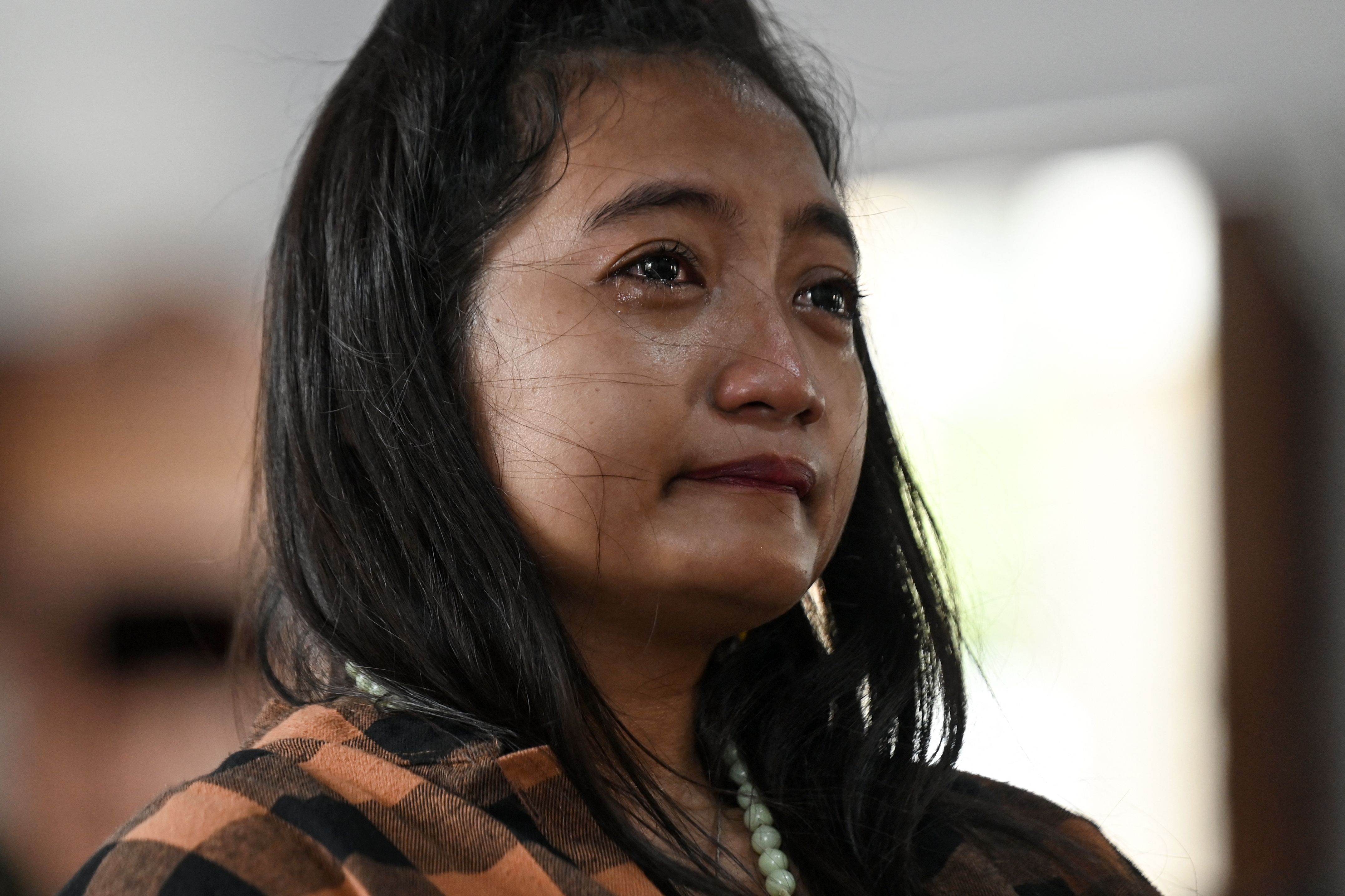 A close-up photo of a woman crying 
