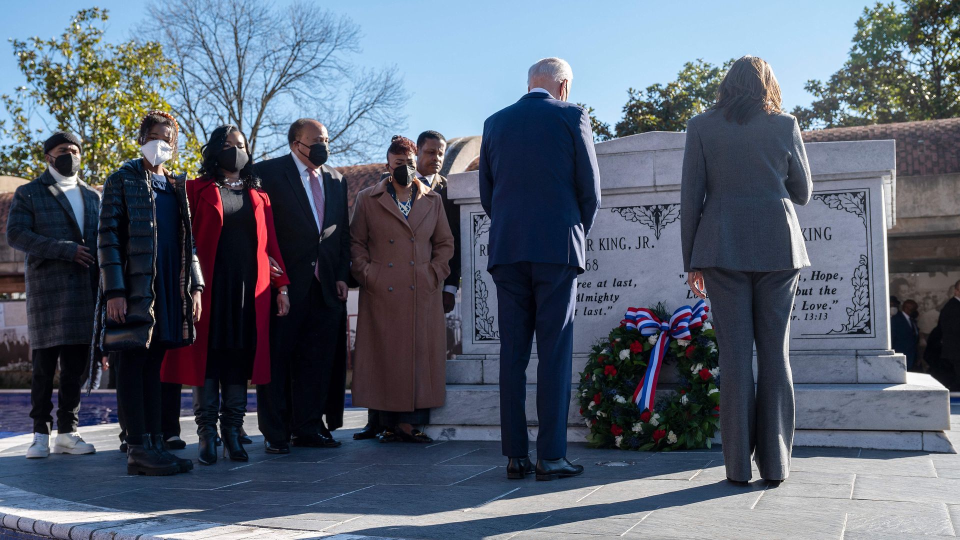 Family members are seen looking on as President Biden and Vice President Kamala Harris pay their respects at the tomb for Martin Luther King Jr. and Coretta Scott King.