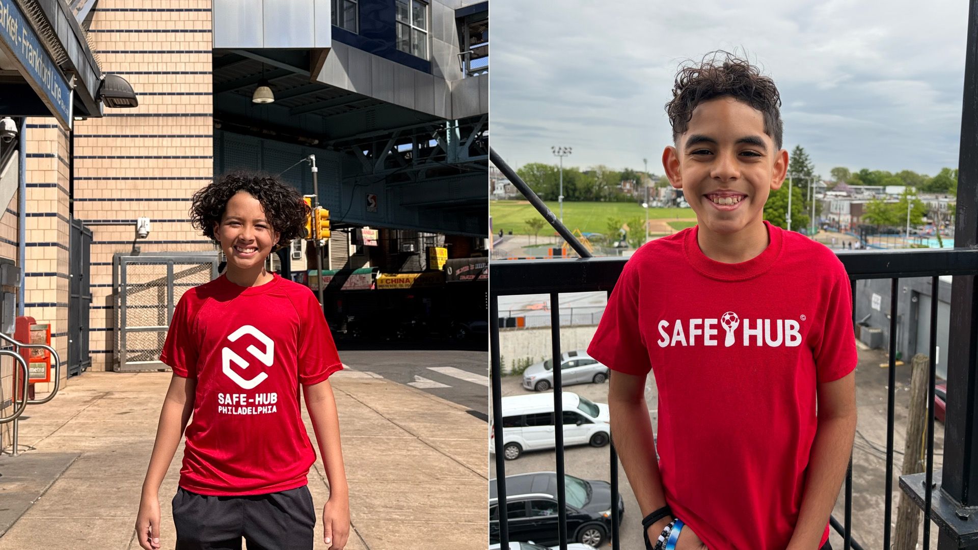 Two boys in red "SAFE HUB" shirts stand outdoors in an urban setting: left, a curly-haired boy by brick walls and elevated tracks; right, a short-haired boy by a railing with a park and city behind.