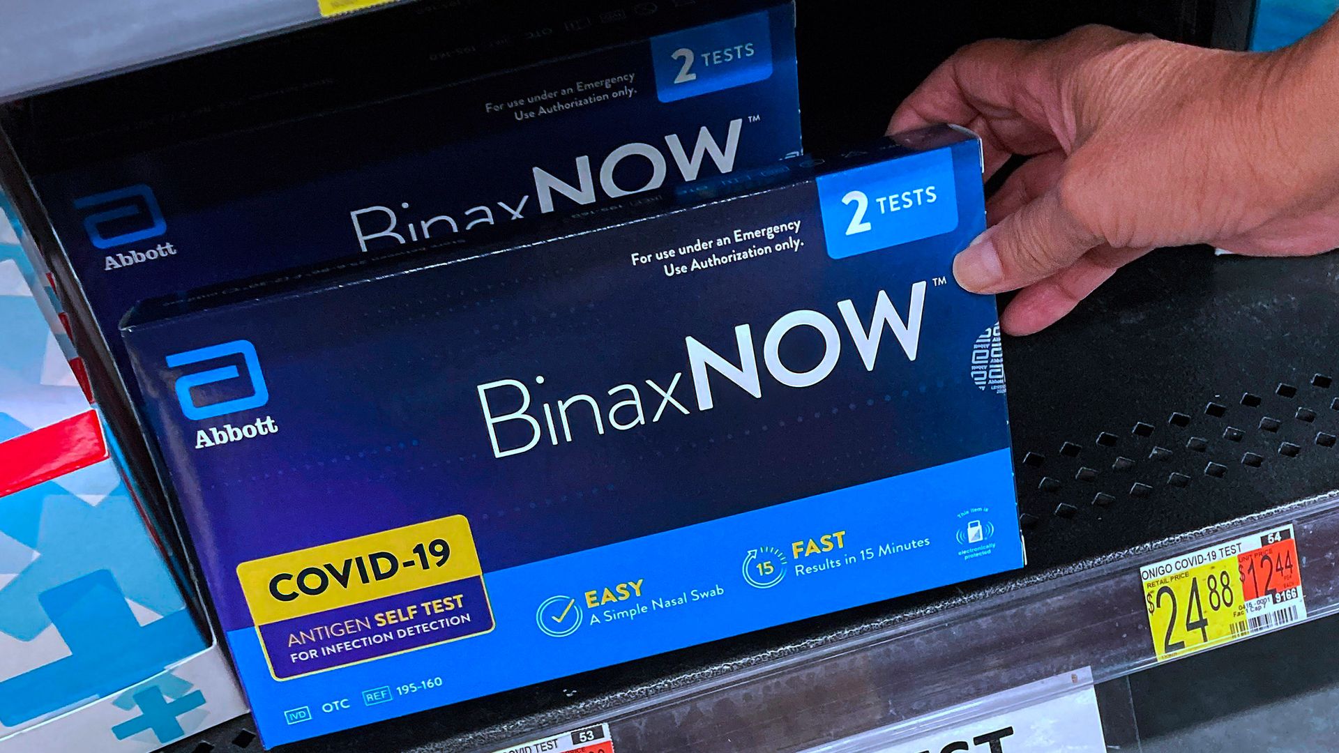 COVID-19 home rapid test kits are seen on a shelf.