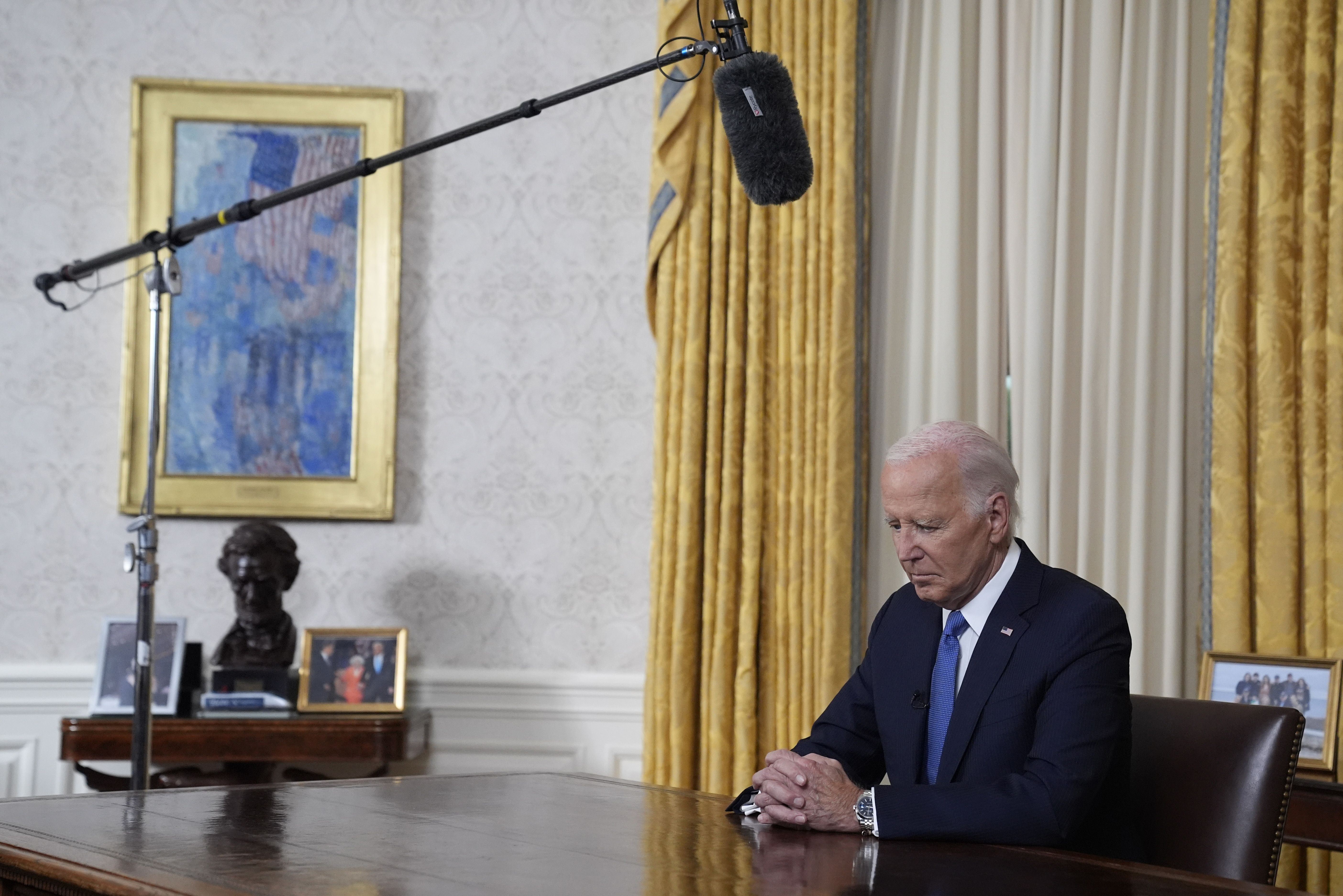 President Biden pauses before he addresses the nation from the Oval Office about his decision to drop his re-election bid.