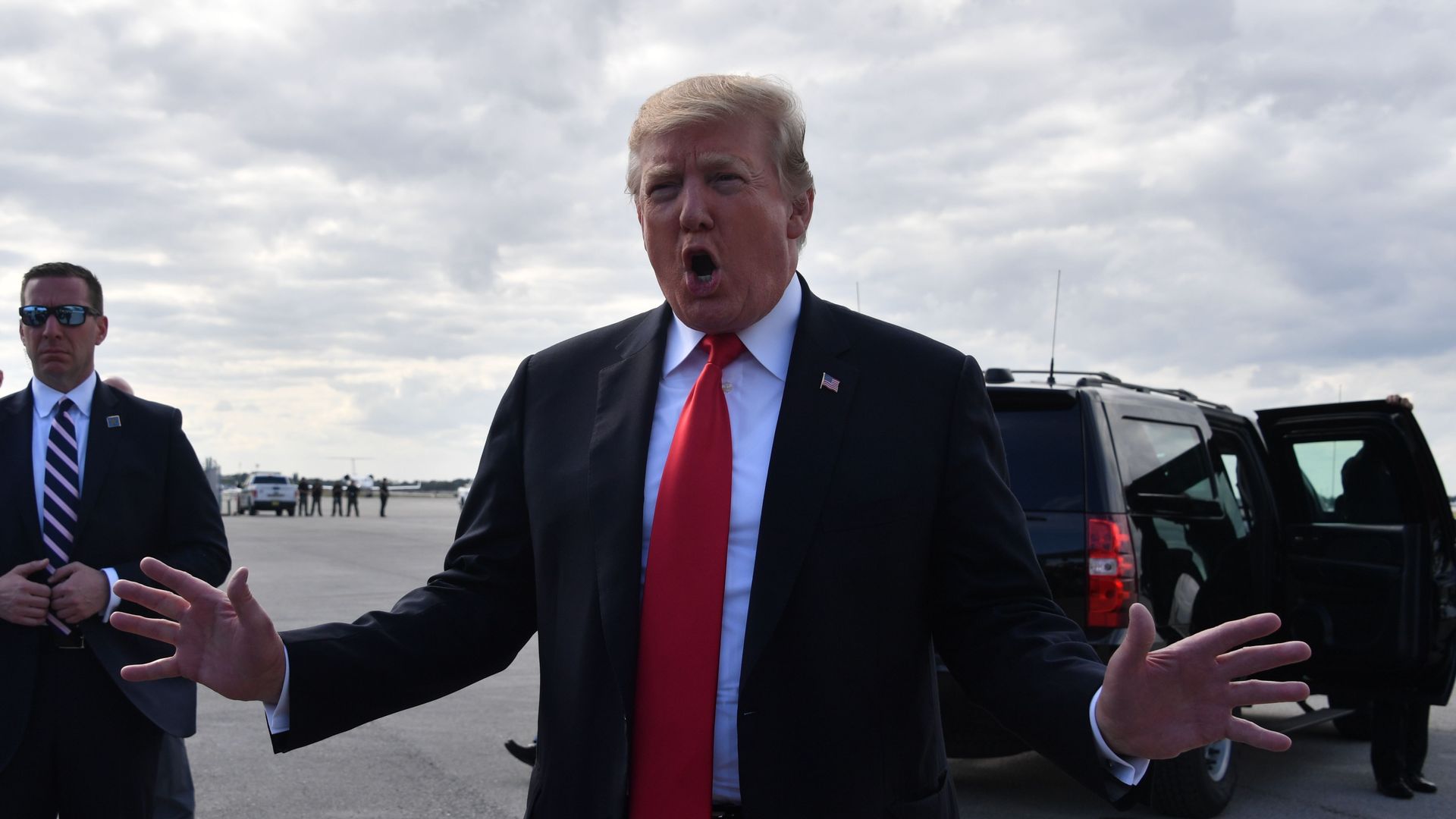 President Trump speaks to reporters at Palm Beach International Airport March 24, 2019.
