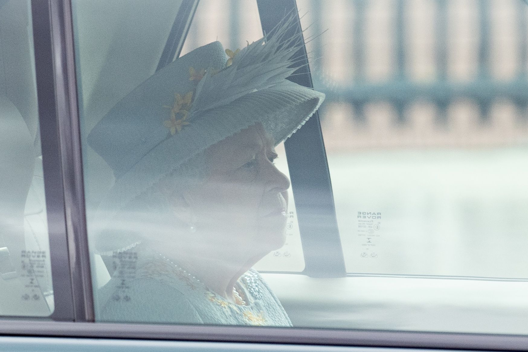 Queen Elizabeth in a car.