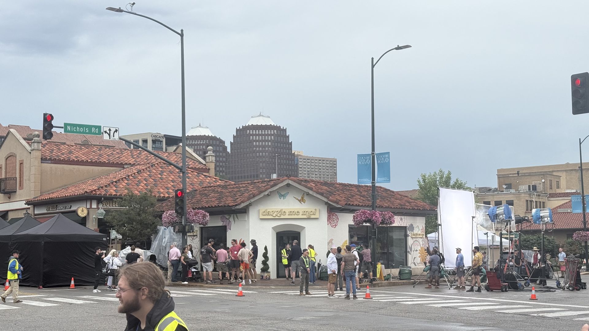 Tents, groups of people, and big lights are seen outside of the Jonny Was store, which was rebranded "dazzle me moi" for filming, as "Ted Lasso" crews shoot season four on the Plaza in Kansas City.