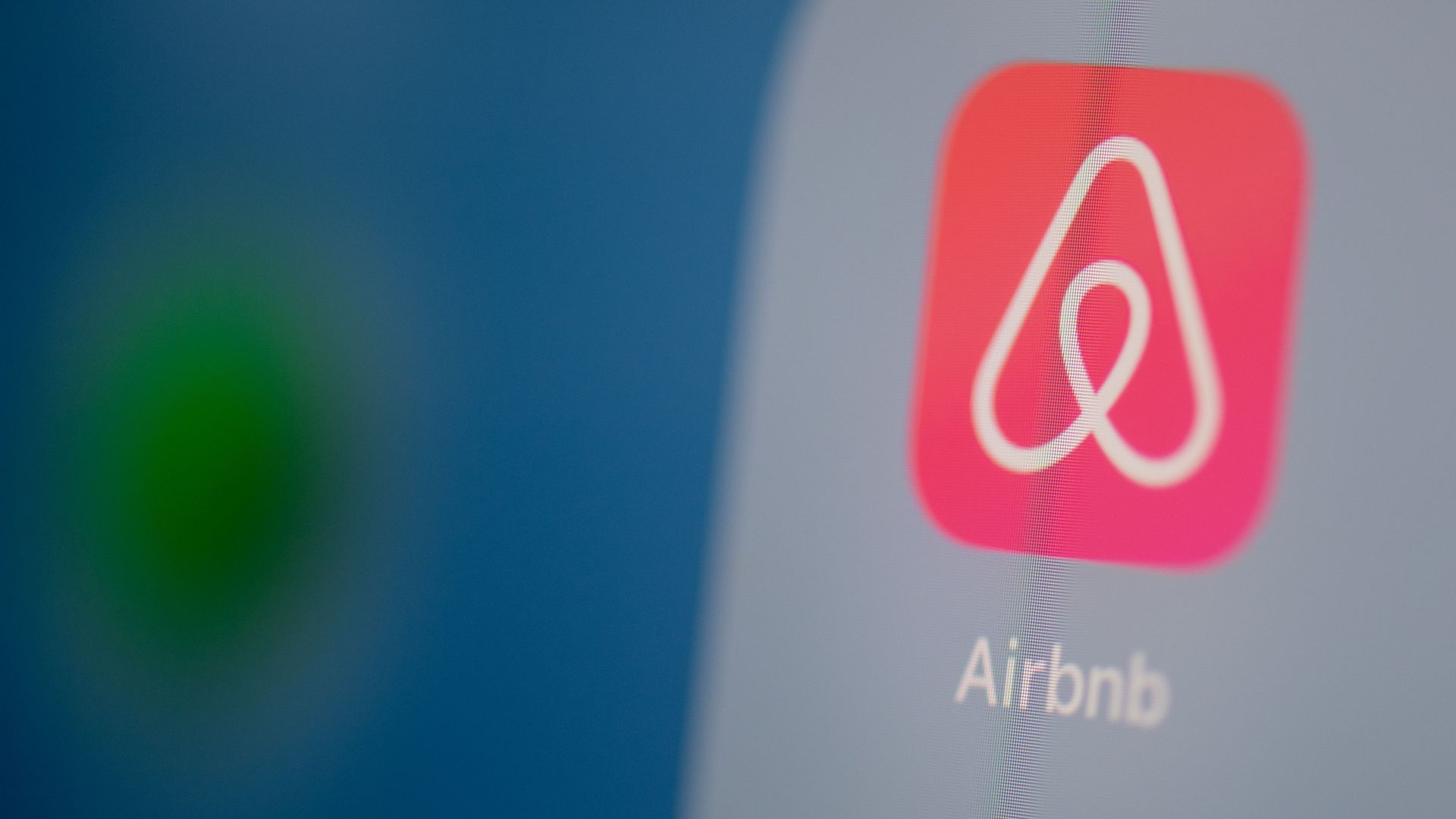 In this image, the Airbnb app is displayed on a smartphone.