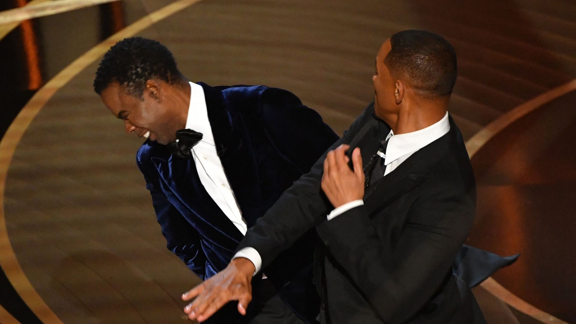 Will Smith slaps Chris Rock onstage at the Oscars