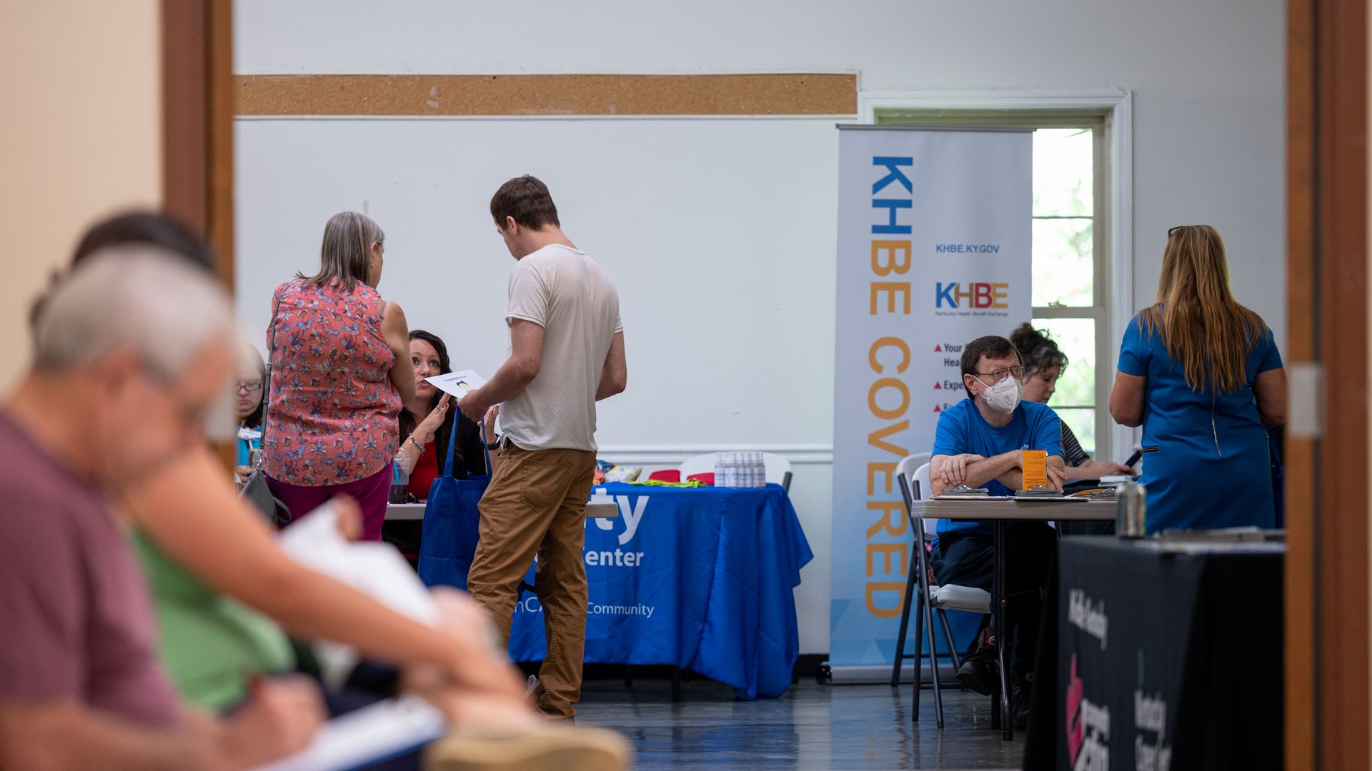 ob seekers speak with hiring representatives during a job fair at a community center in Beattyville, Kentucky, U.S., on Wednesday, July 28, 2021.