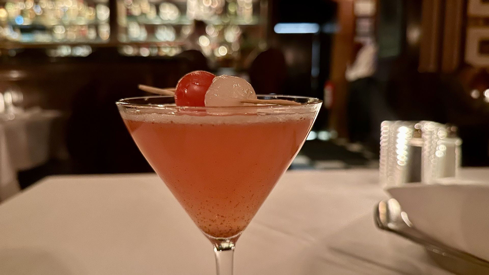 A photo of a pinkish tomato martini
