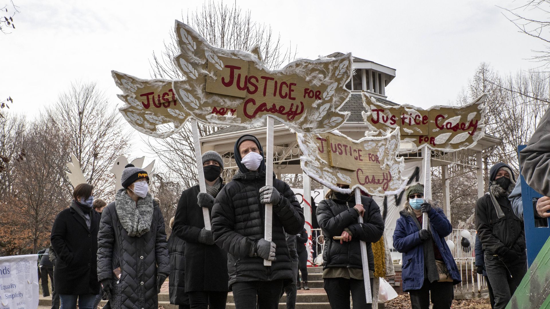 Protesters depart from Goodale Park with signs reading "Justice for Casey" during the protest.