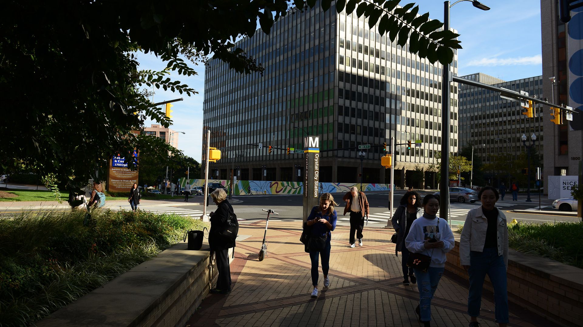 People walking around crystal city metro stop 
