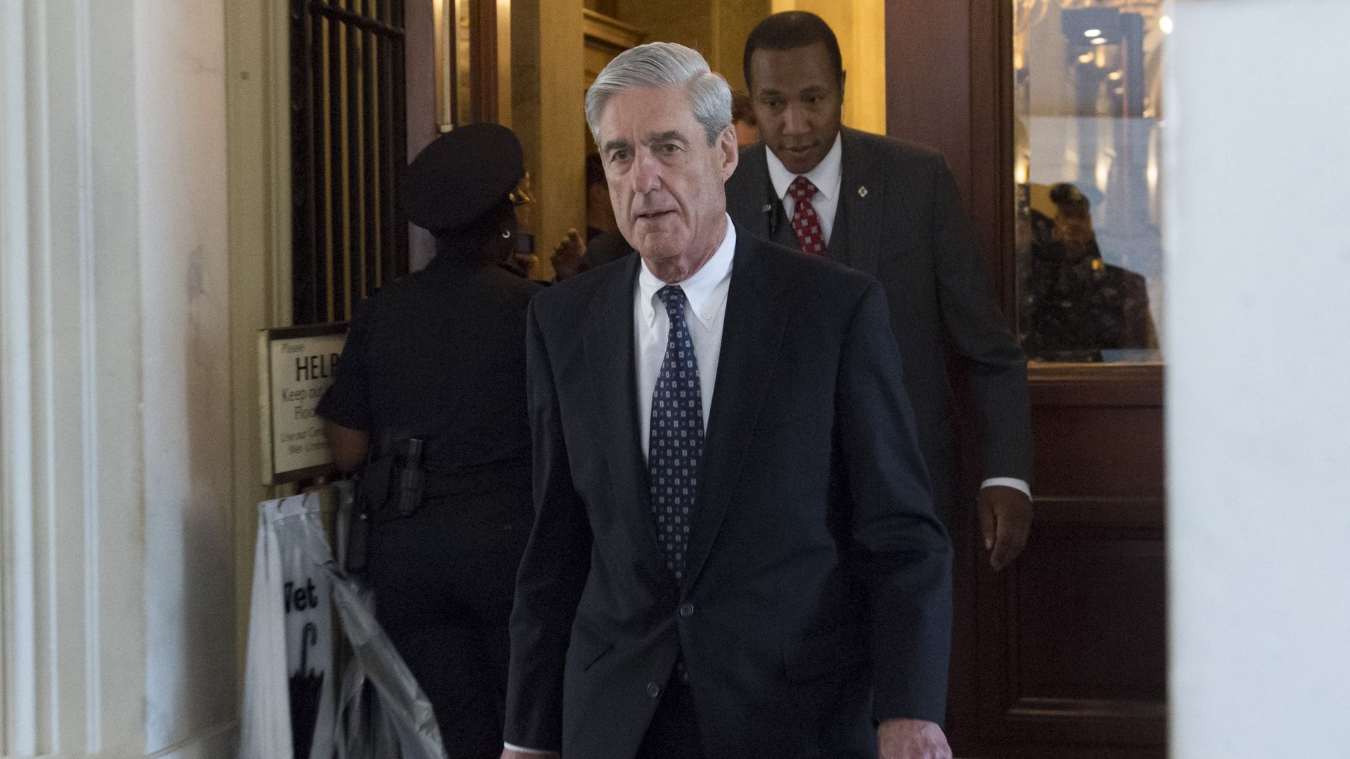 Robert Mueller walks down the stairs of the Capitol