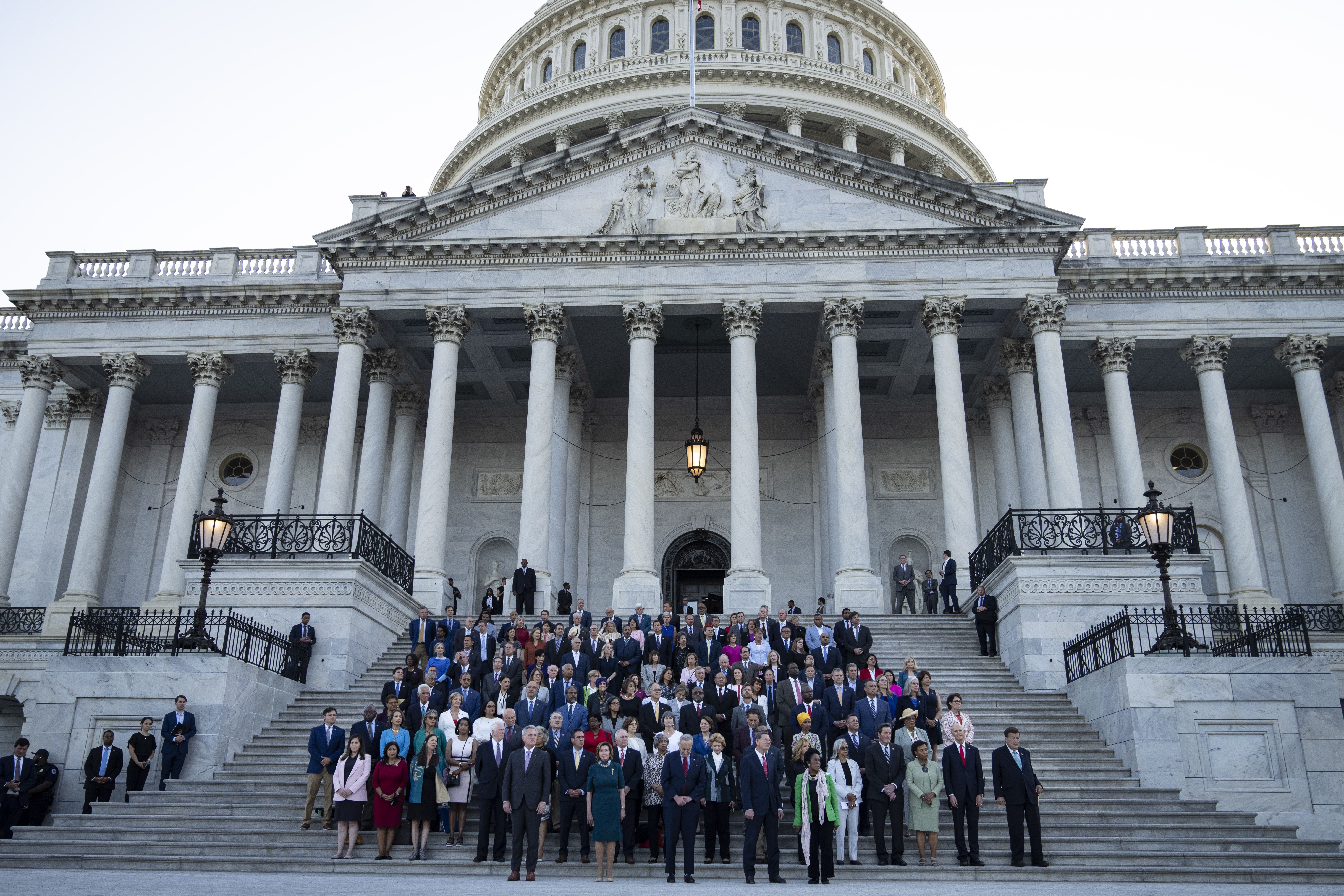 Members of Congress hold a moment of silence for the 600,000 American lives lost to COVID-19, on the steps of the U.S. Capitol on June 14