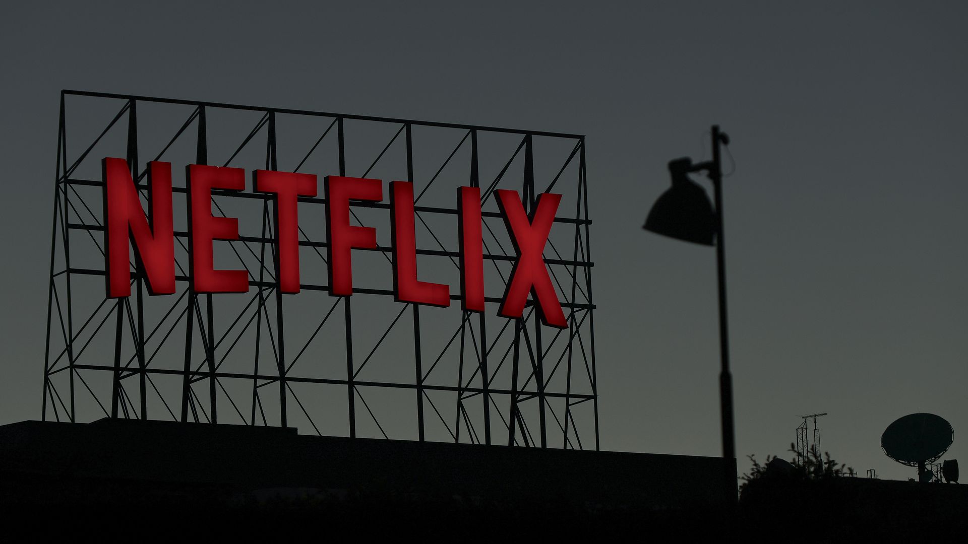 Netflix logo at dusk.
