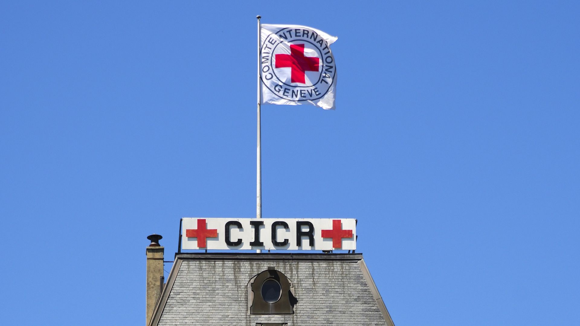 Headquarters of the International Committee of the Red Cross, ICRC, with the Red Cross flag, Geneva, Switzerland.