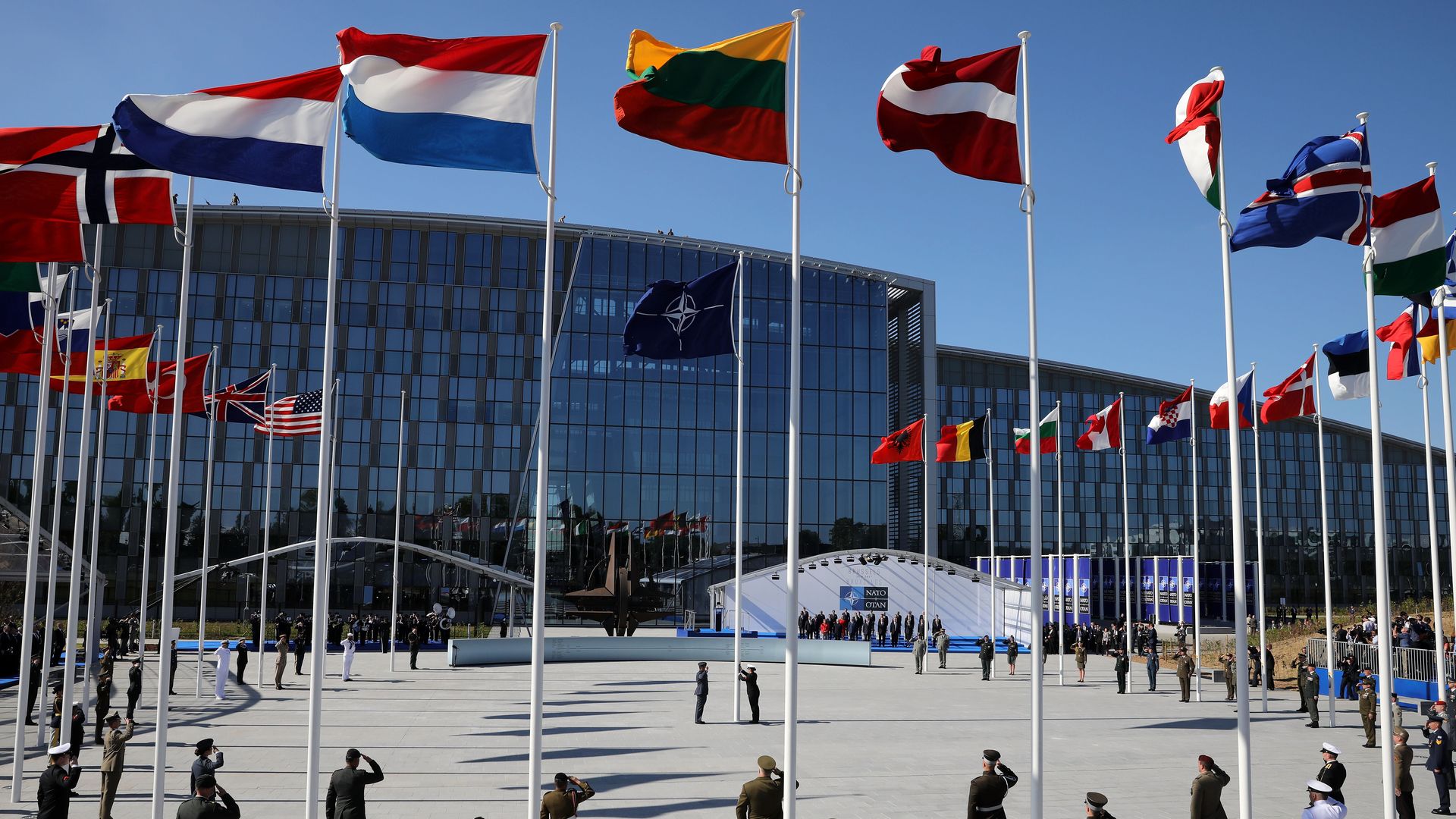NATO headquarters, with circle of flagpoles and soldiers at attention