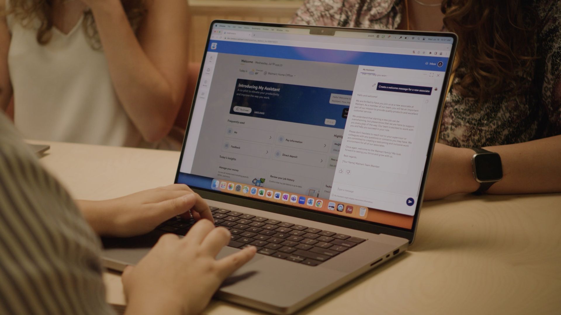 A Walmart employee using a new generative AI app for corporate employees.