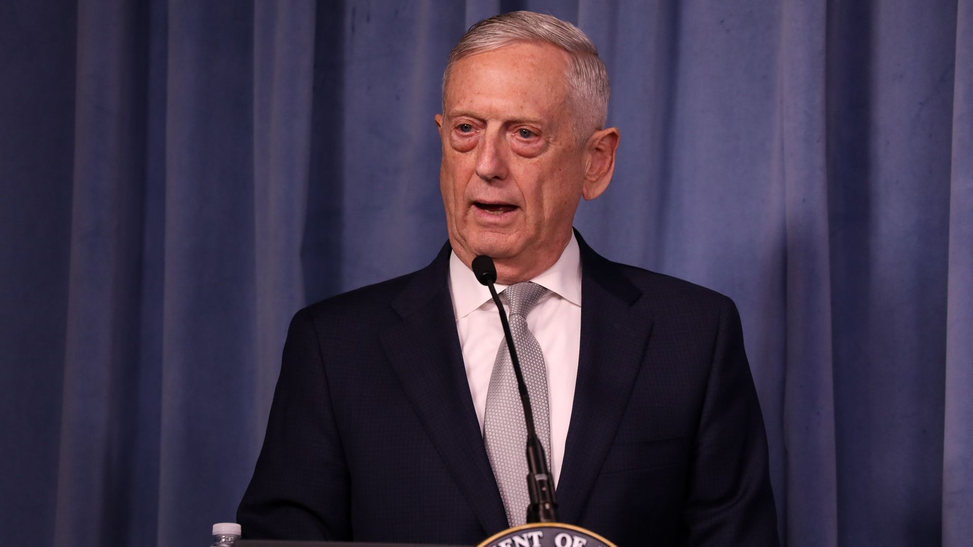 Secretary Mattis at a lectern