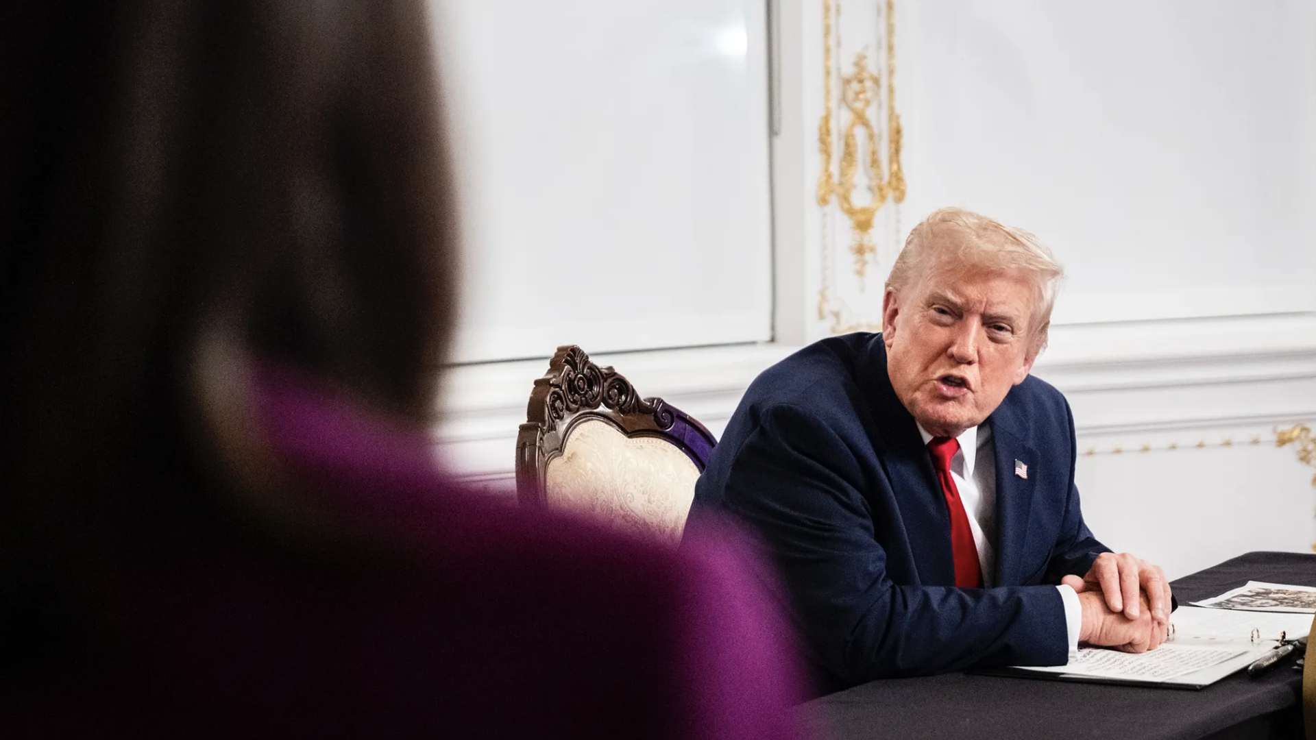 President Trump speaks with reporters at Mar-a-Lago on Thanksgiving Day. Photo: Pete Marovich/Getty Images
