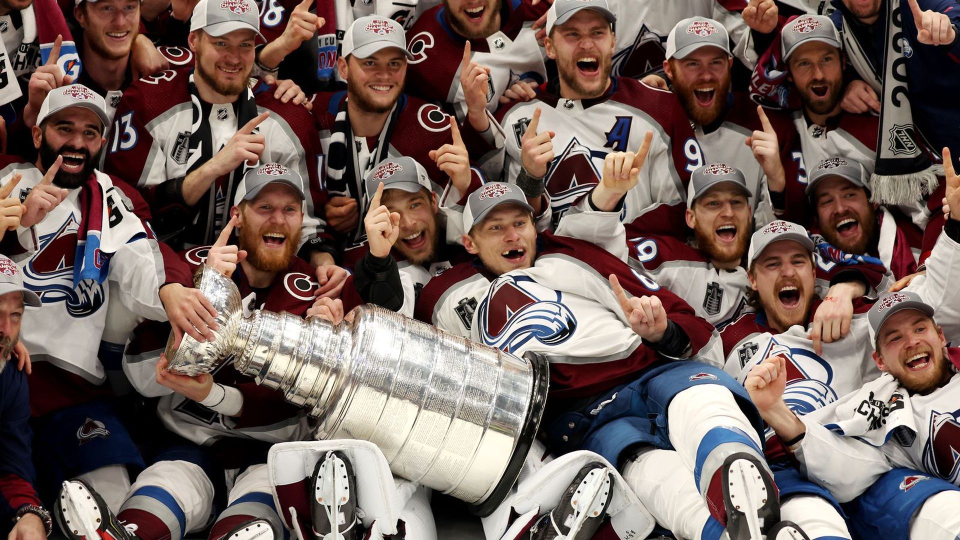 The Colorado Avalanche celebrate with the Stanley Cup.