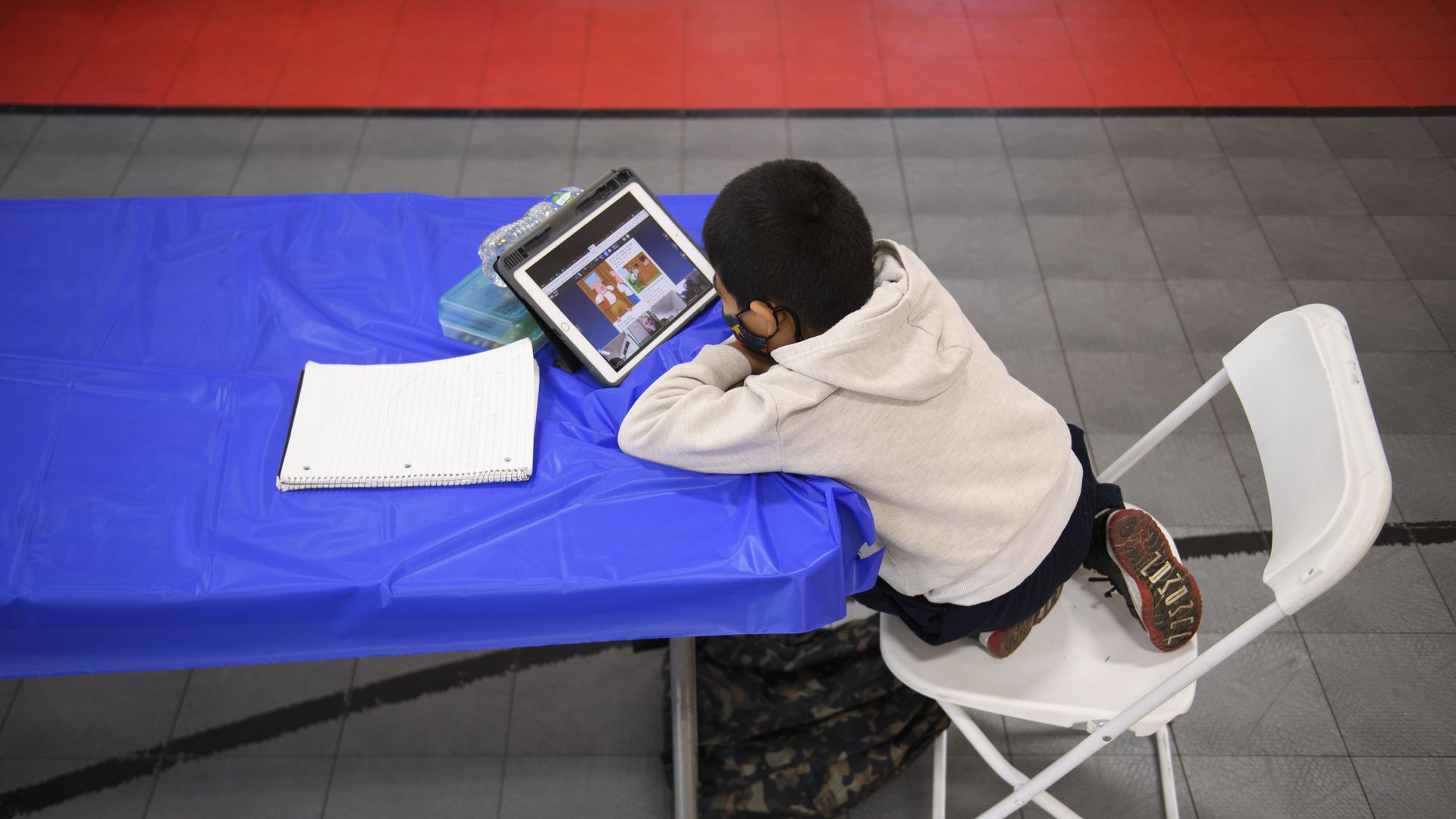 A photo of a child learning remotely.
