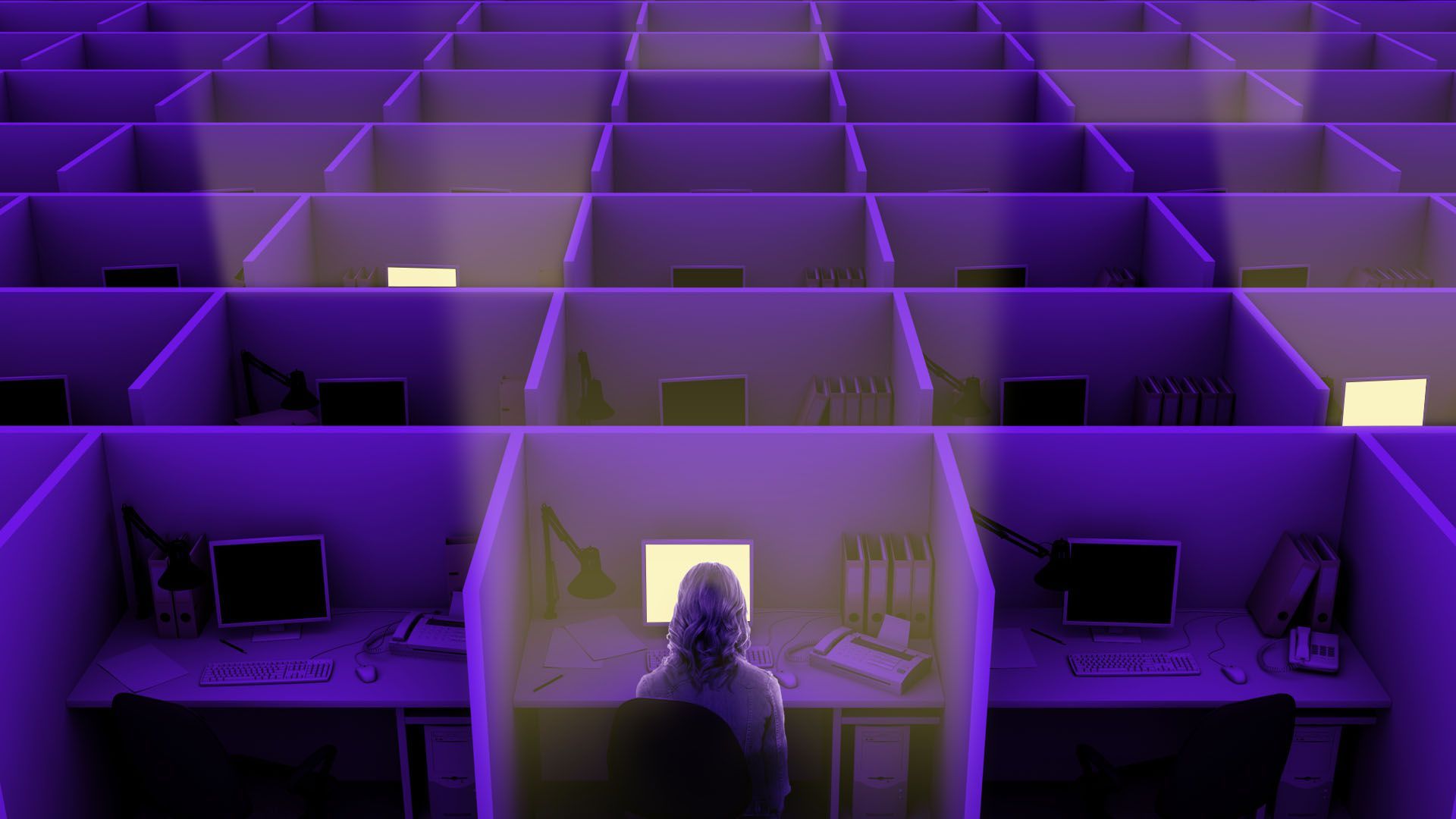 Illustration of a dark room full of cubicles, with some lit up by computer screens